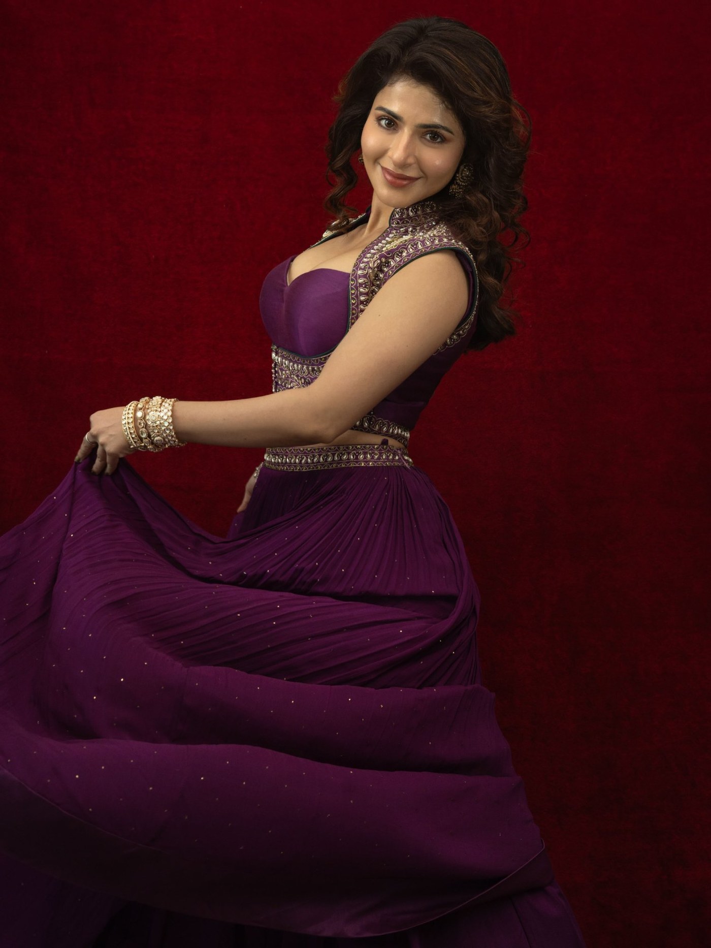 Iswarya Menon shines in an elaborate, deep purple lehenga with intricate detailing and flowing dupatta.