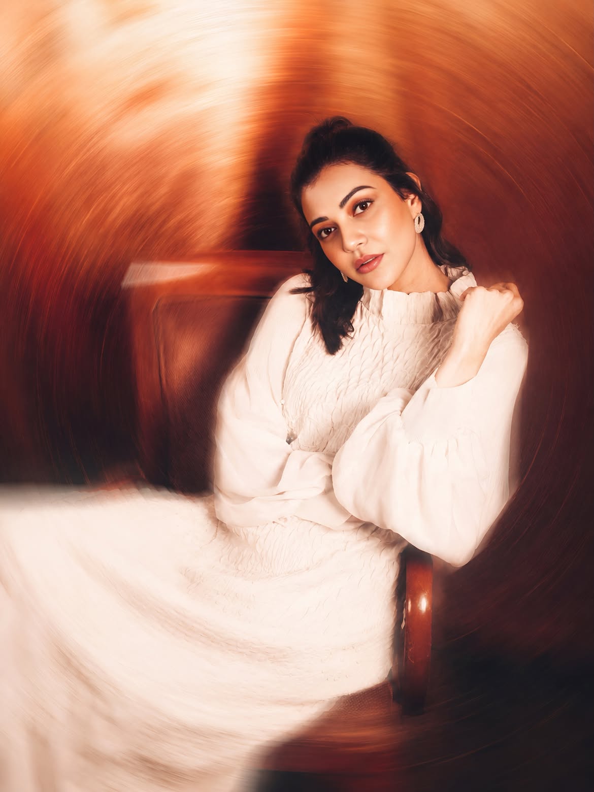 Kajal Aggarwal shines in a sophisticated white ethnic-inspired outfit, radiating modern elegance.