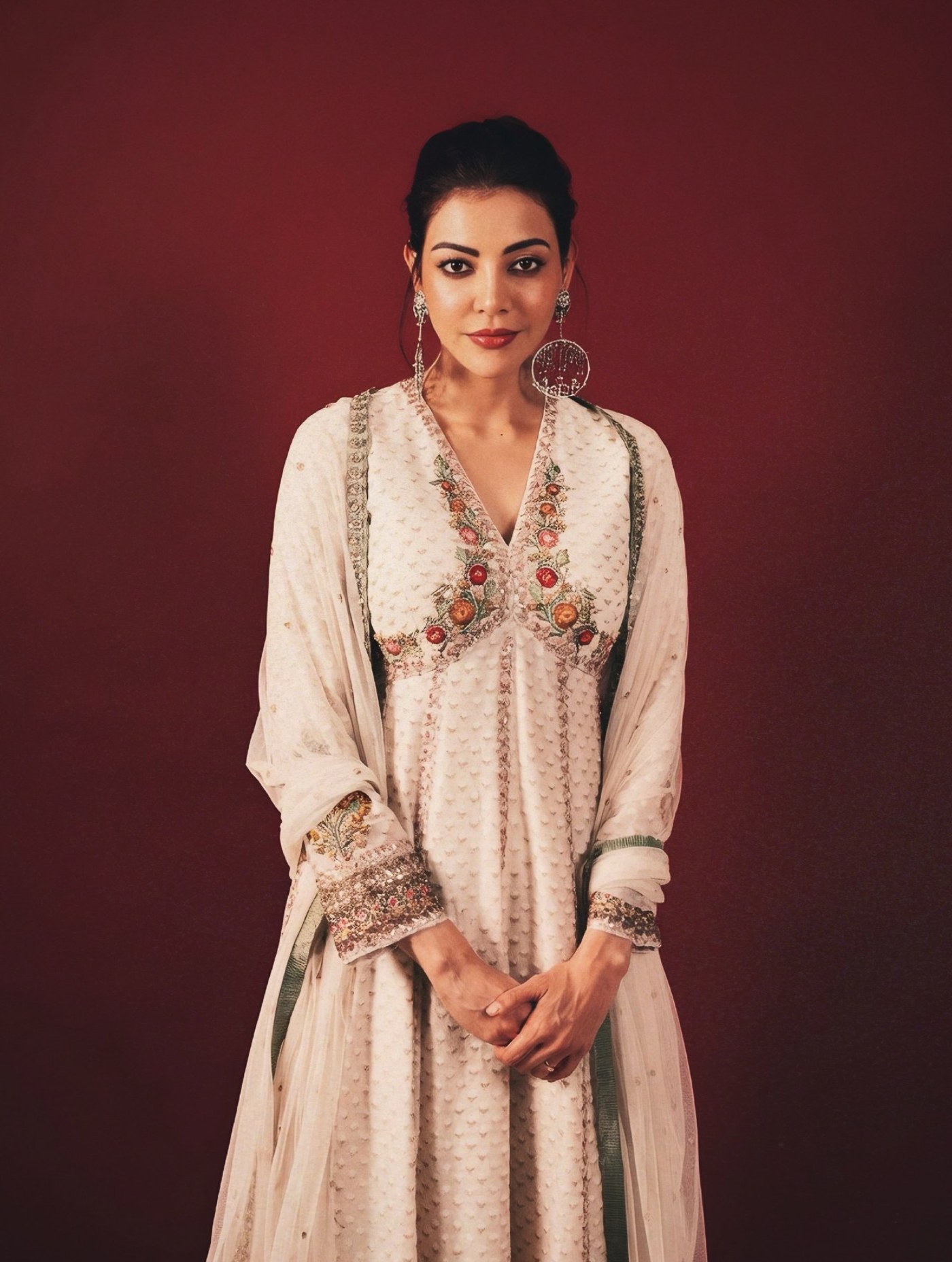 Kajal Aggarwal showcases a regal ethnic ensemble, embodying sophisticated traditional fashion at the event. - Photos & Updates
