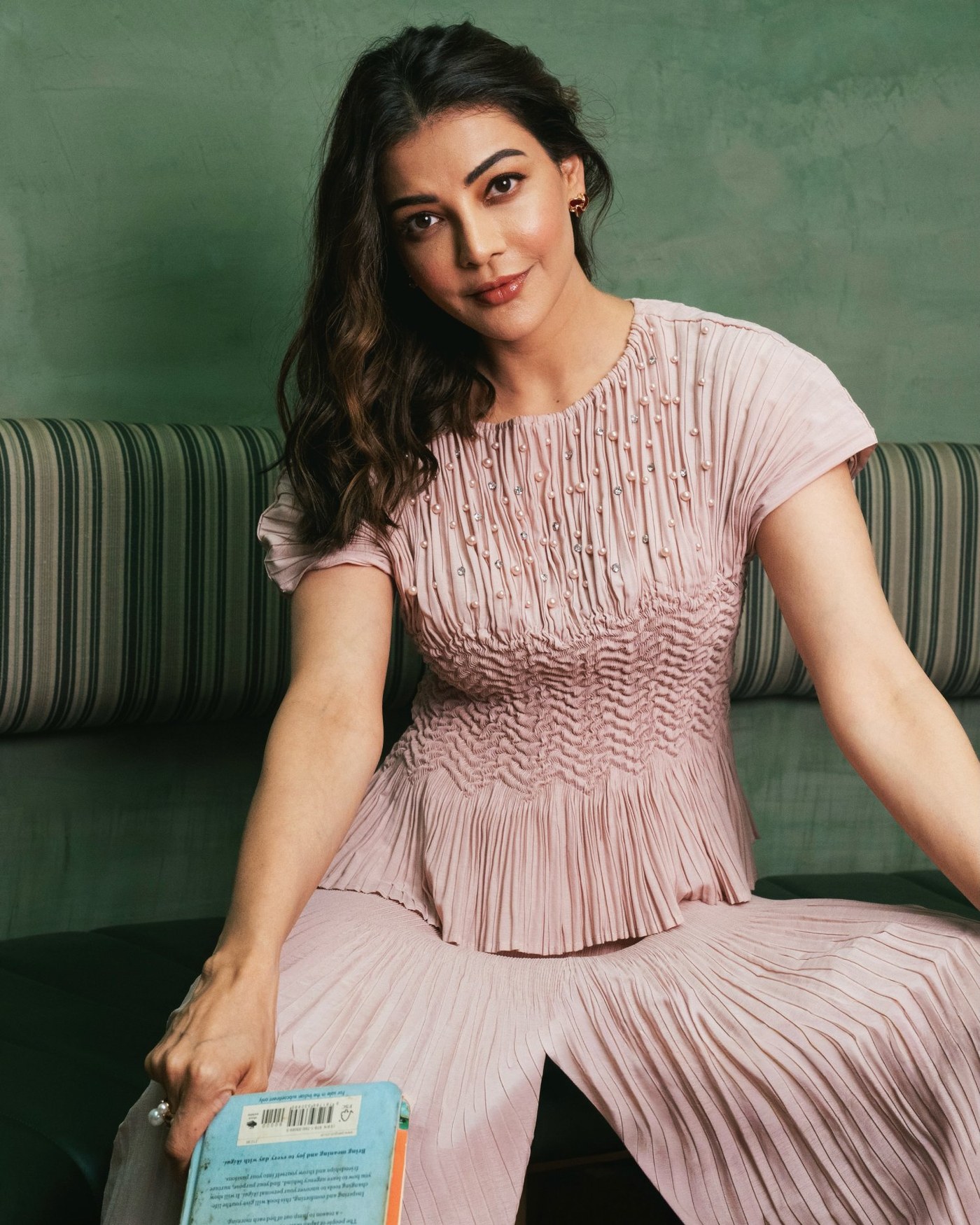 Kajal Aggarwal showcases her graceful style in a beautiful, textured blush pink ensemble.