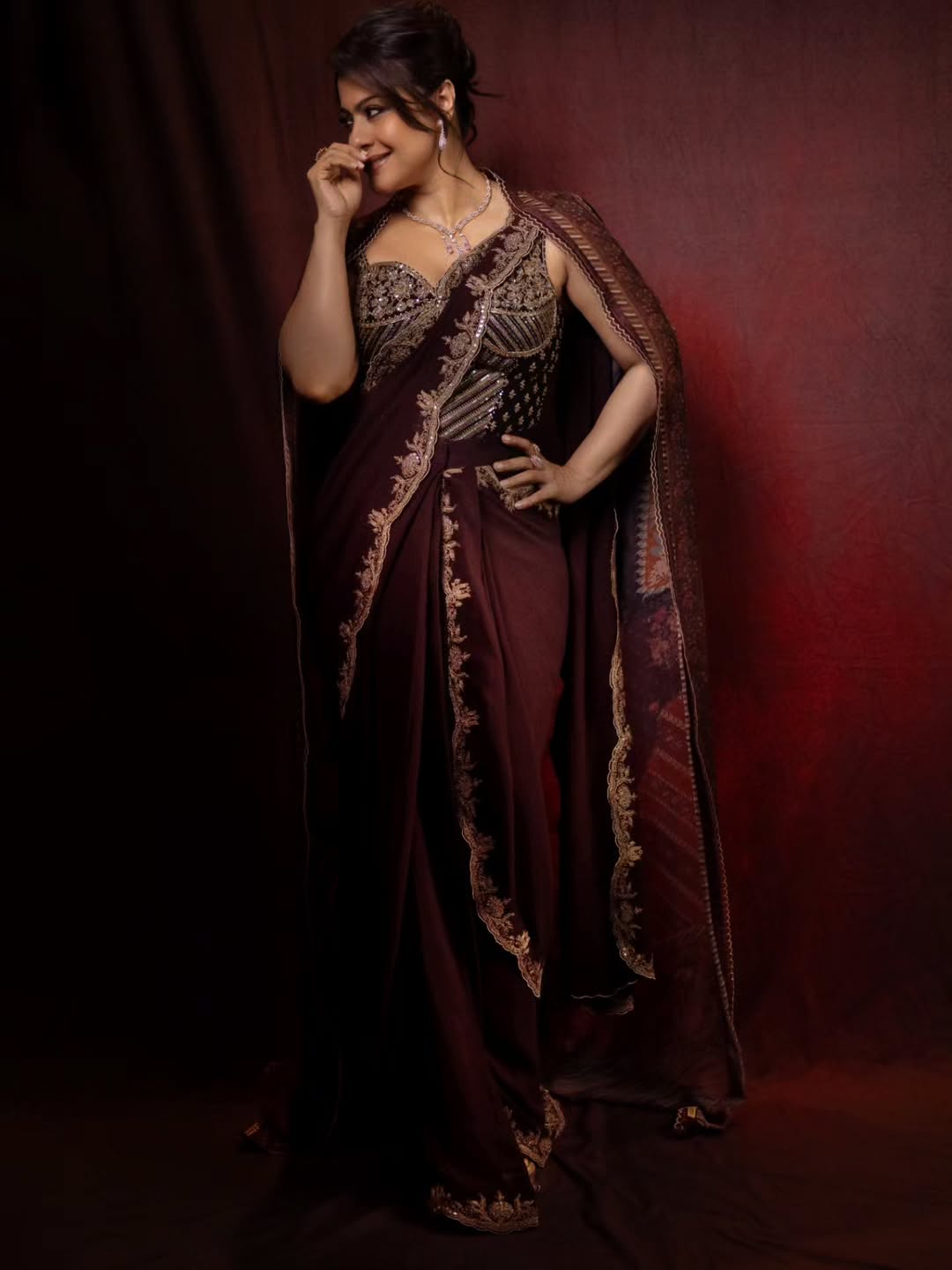 Kajol's Regal Charm: Maroon & Gold Elegance