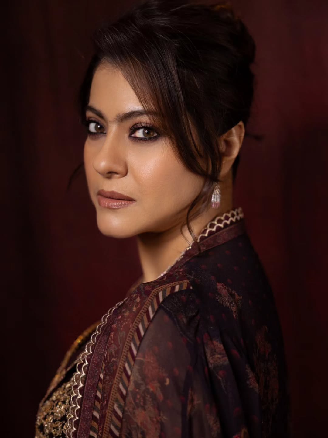 Kajol's Regal Charm: Maroon & Gold Elegance