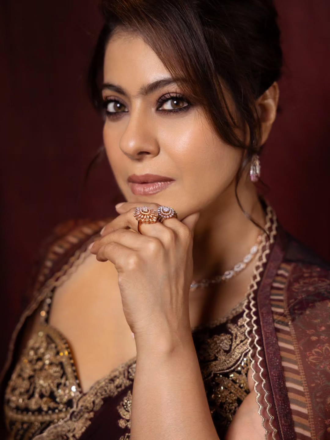 Kajol's Regal Charm: Maroon & Gold Elegance