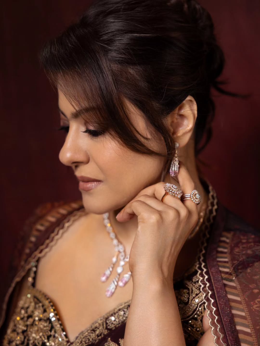 Kajol's Regal Charm: Maroon & Gold Elegance