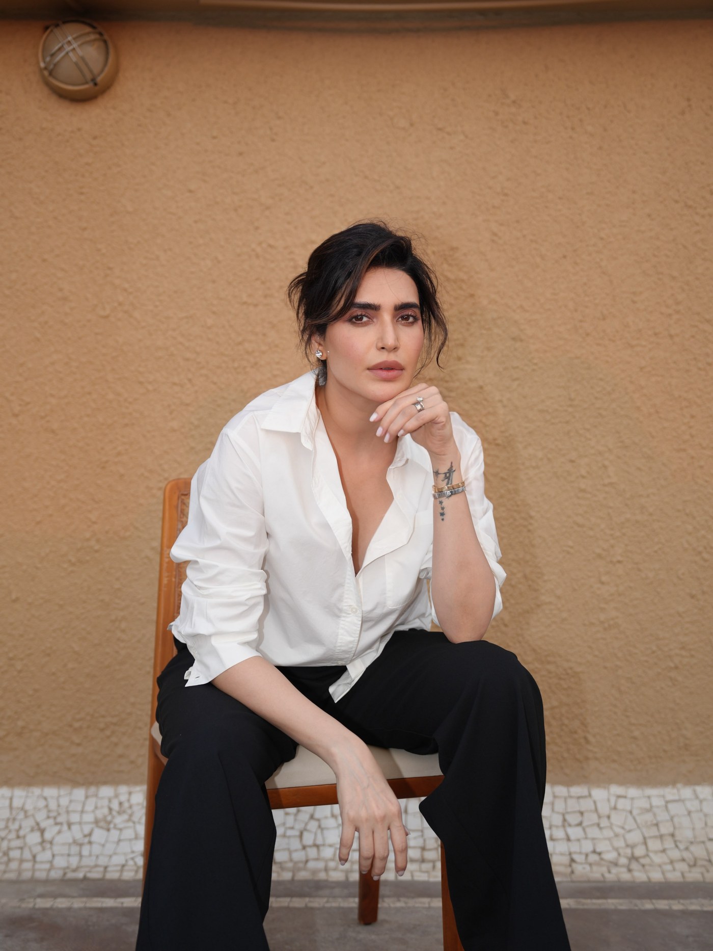 Karishma Tanna embodies boss-lady energy in a beautifully tailored classic black and white ensemble.