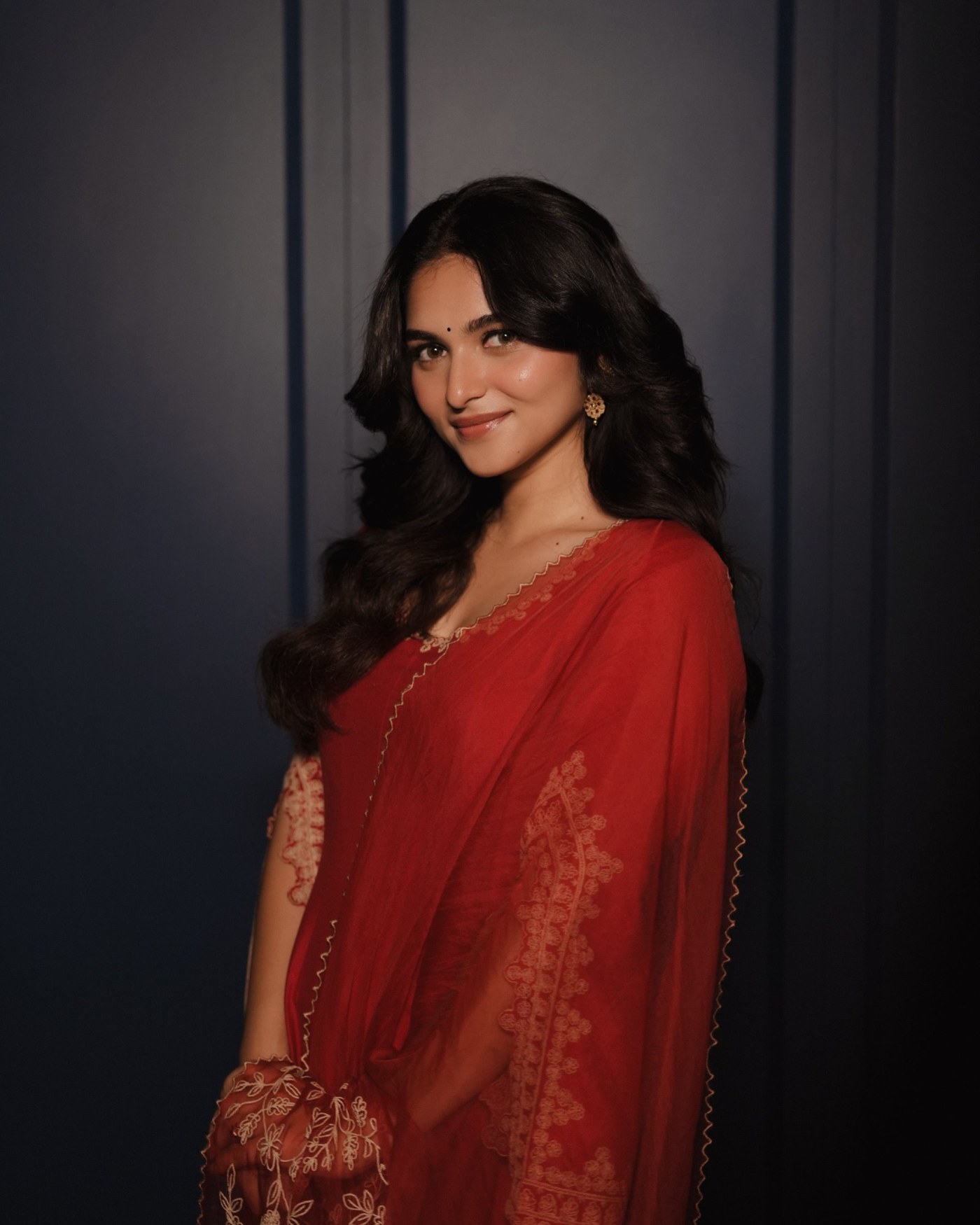 Kayadu Lohar is pictured in a deeply colored, intricately detailed ethnic ensemble, highlighting structured drape and fluid movement.