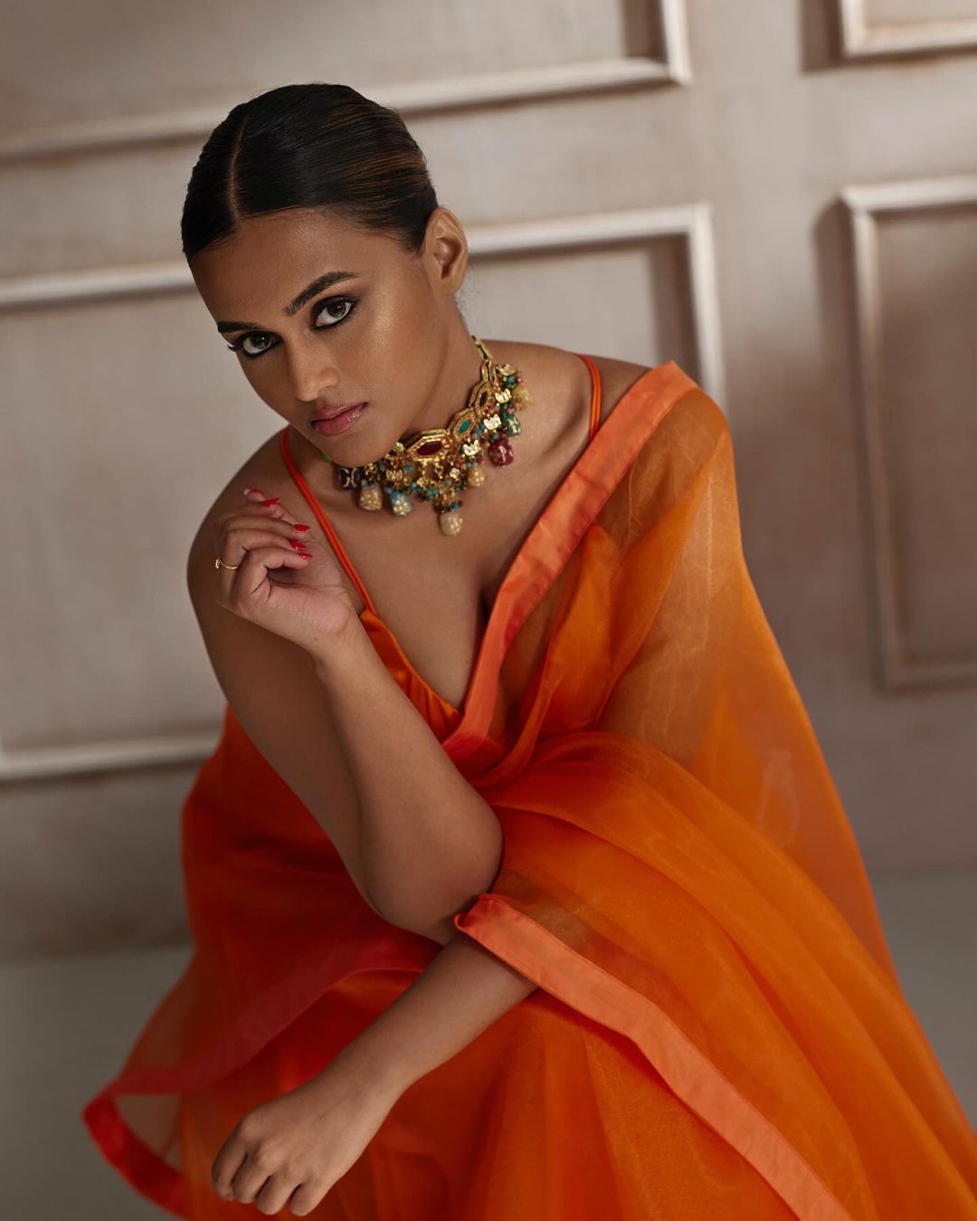 Kyraa Vasudevan's Vibrant Red & Gold Ensemble