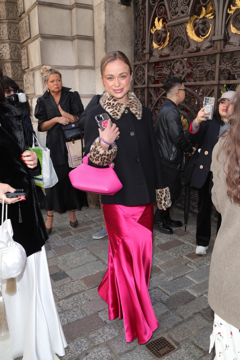Lady Amelia Windsor posing elegantly at a formal event, showcasing exquisite attire and poise.