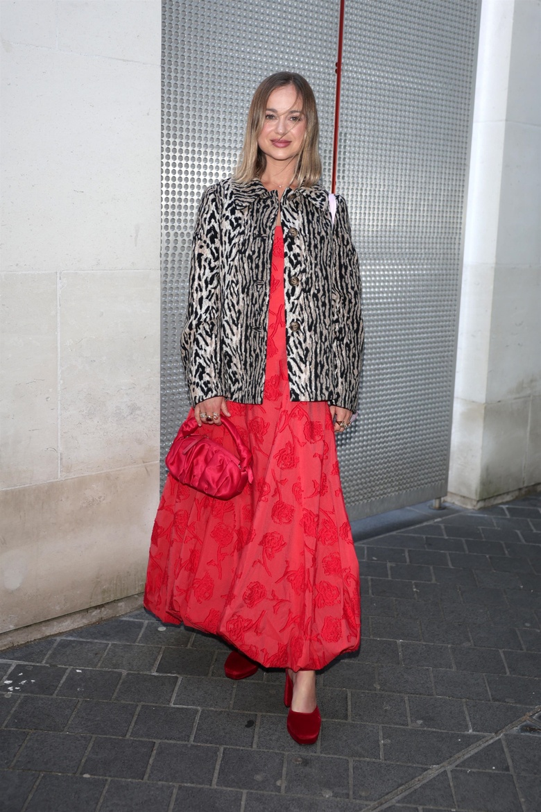 Lady Amelia Windsor smiles brightly while attending a formal daytime event.
