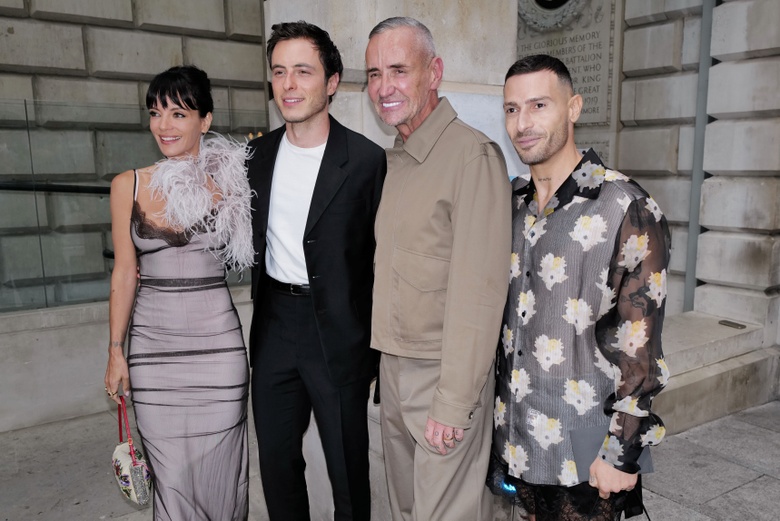 Lily Allen smiling warmly outdoors, showcasing a bright and friendly expression.