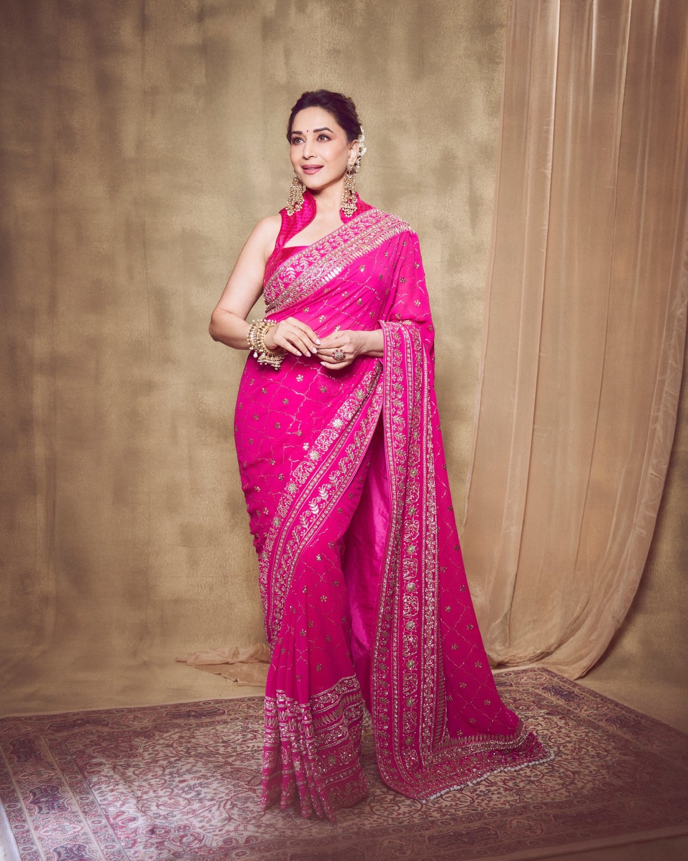 Madhuri Dixit's Timeless Pink Saree Glow: An Ode to Bollywood Elegance!