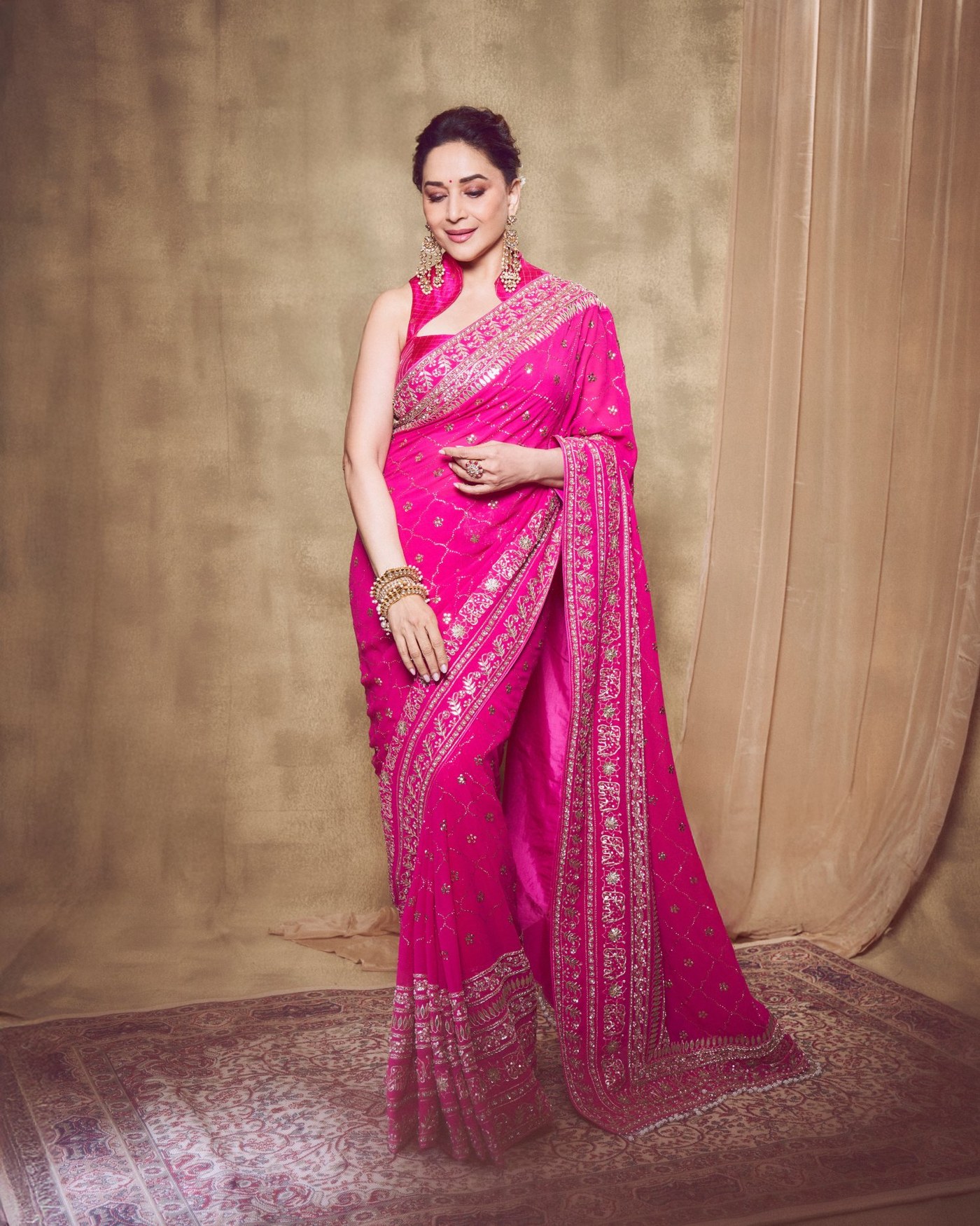 Madhuri Dixit's Timeless Pink Saree Glow: An Ode to Bollywood Elegance!