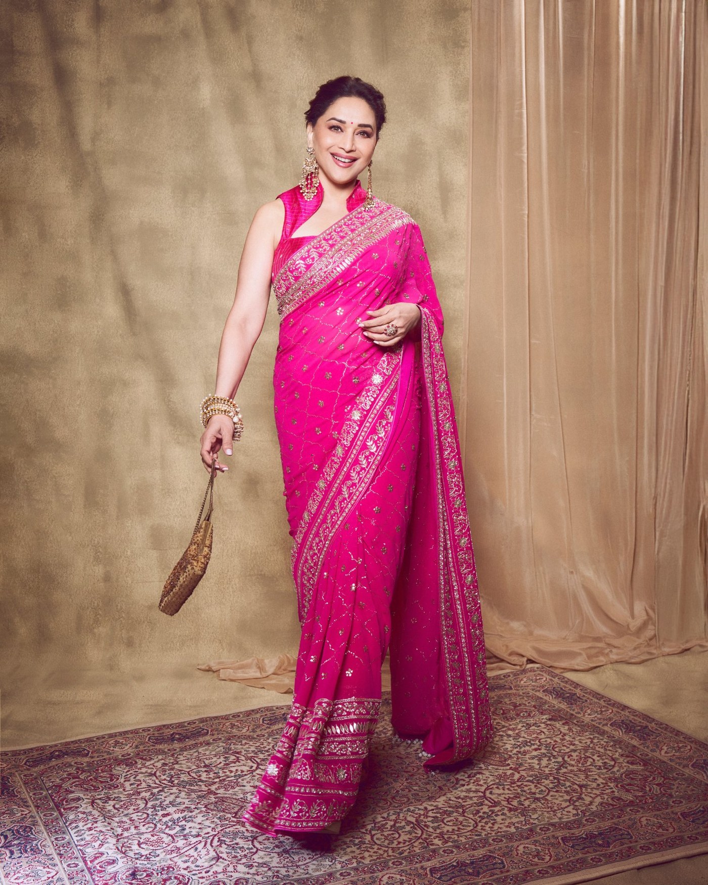 Madhuri Dixit's Timeless Pink Saree Glow: An Ode to Bollywood Elegance!