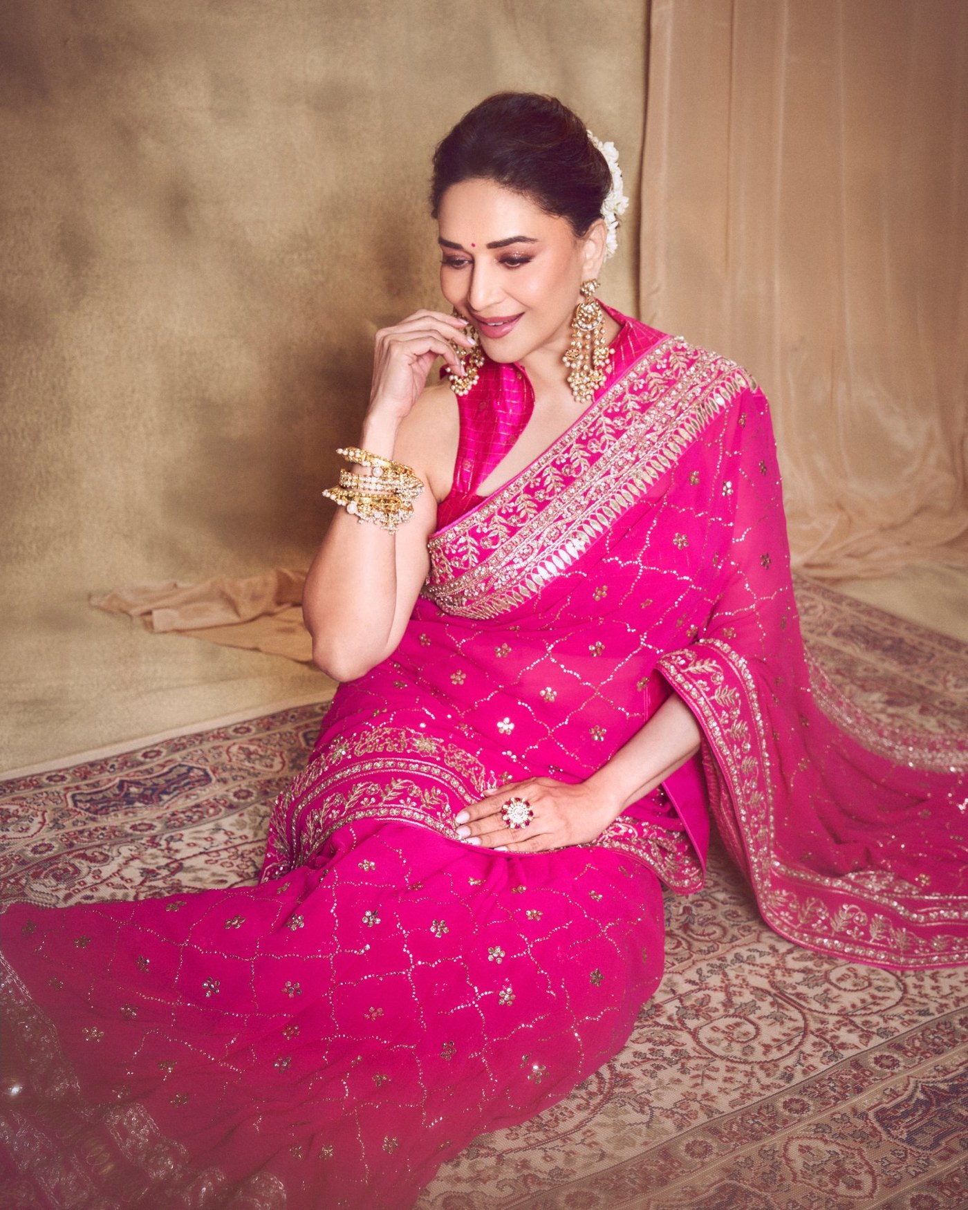 Madhuri Dixit's Timeless Pink Saree Glow: An Ode to Bollywood Elegance!