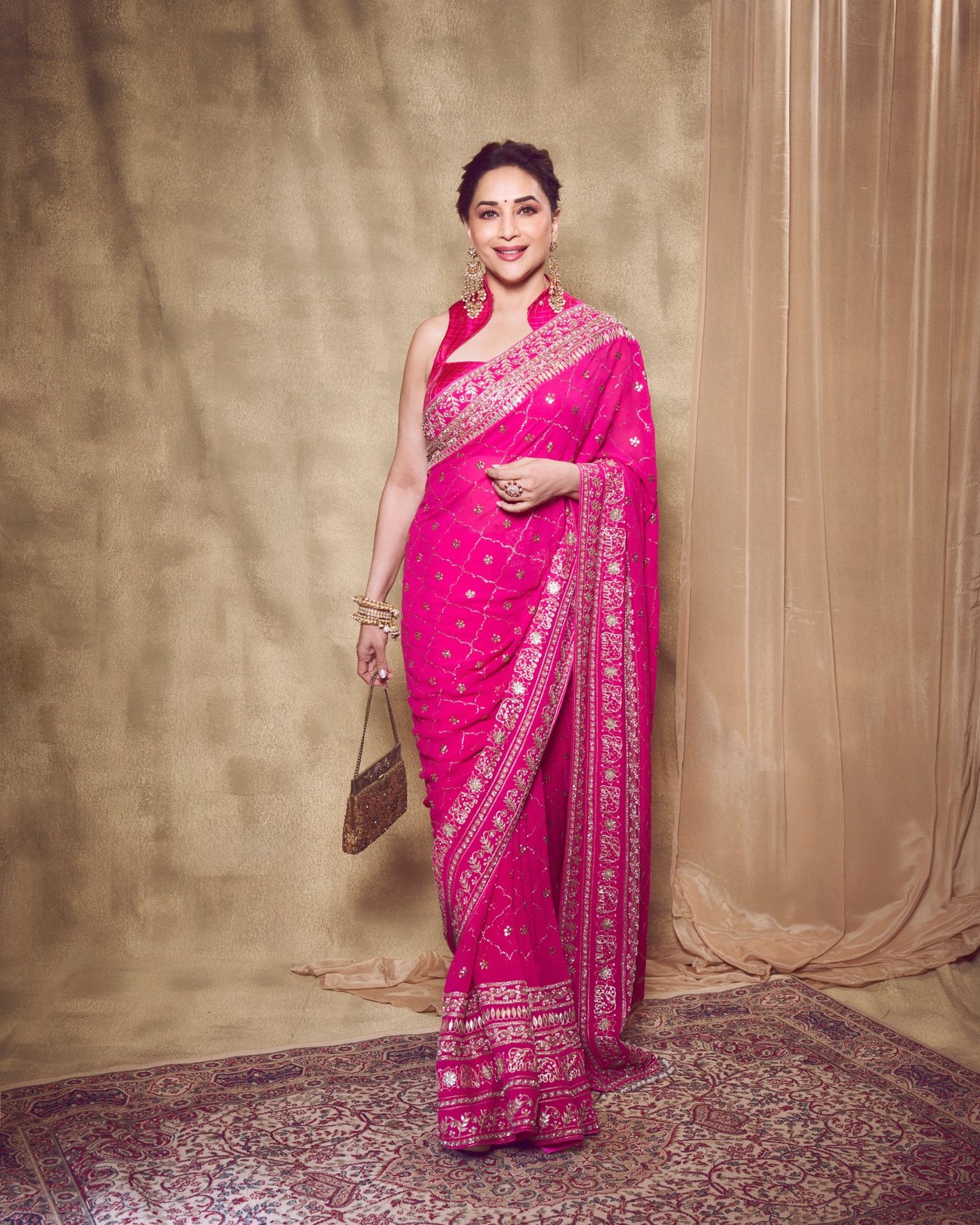 Madhuri Dixit's Timeless Pink Saree Glow: An Ode to Bollywood Elegance!