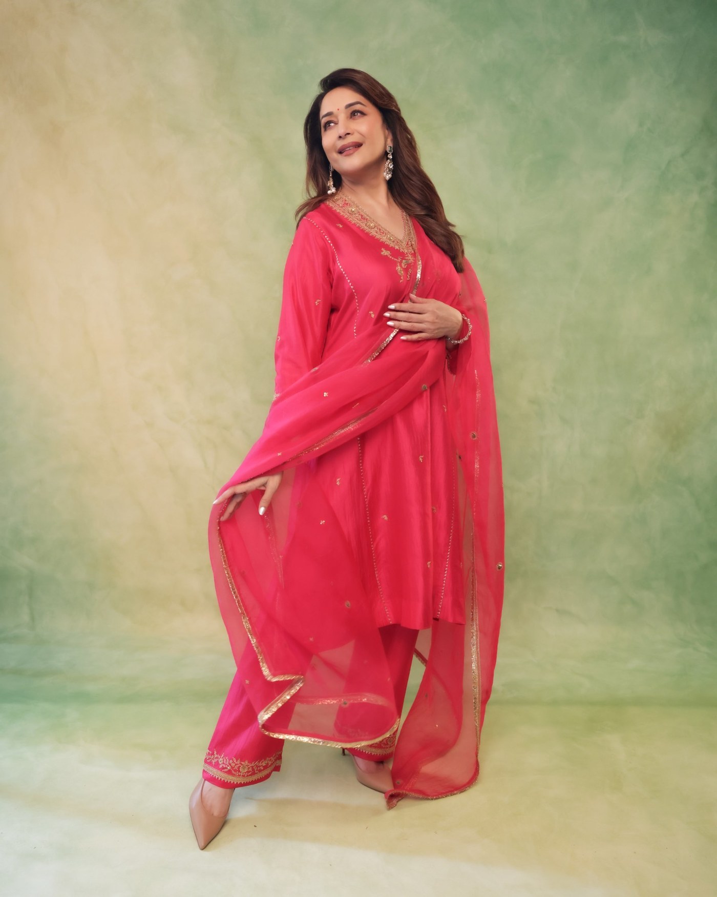 Madhuri Dixit’s Golden Glow: Effortless Elegance in Pink Perfection