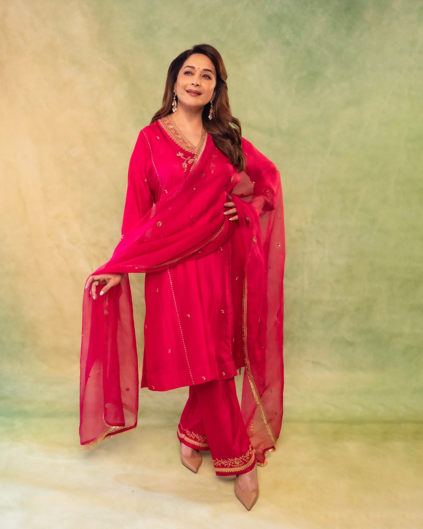 Madhuri Dixit’s Golden Glow: Effortless Elegance in Pink Perfection