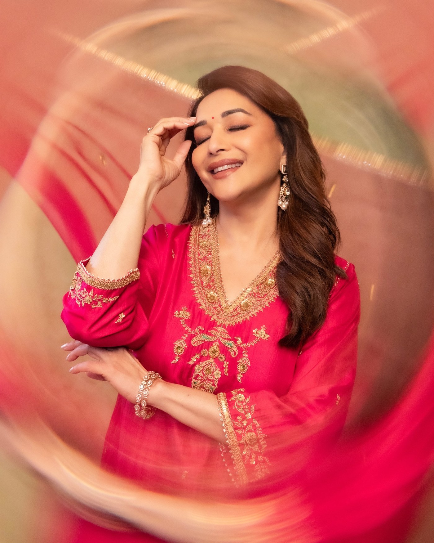 Madhuri Dixit’s Golden Glow: Effortless Elegance in Pink Perfection
