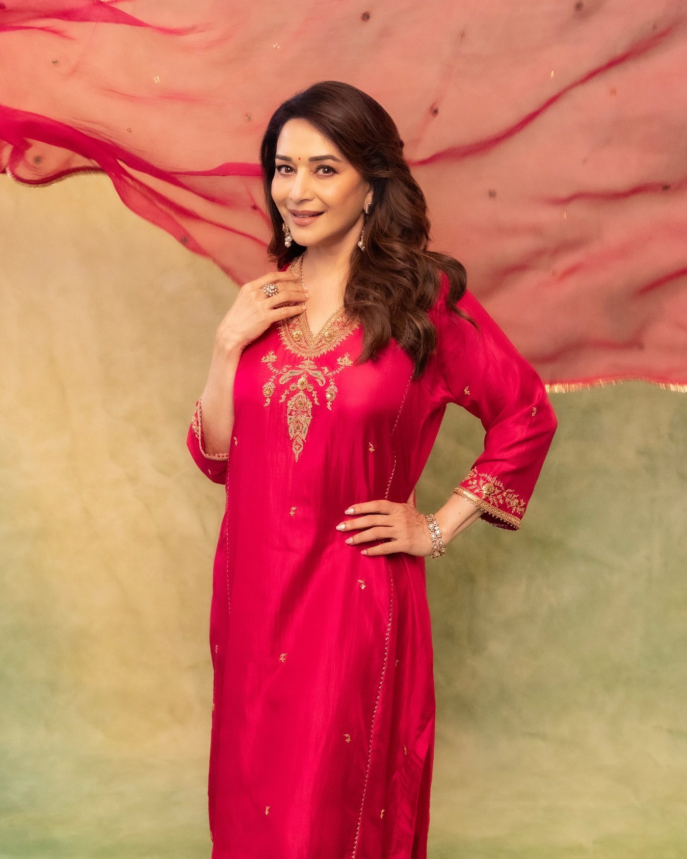 Madhuri Dixit’s Golden Glow: Effortless Elegance in Pink Perfection