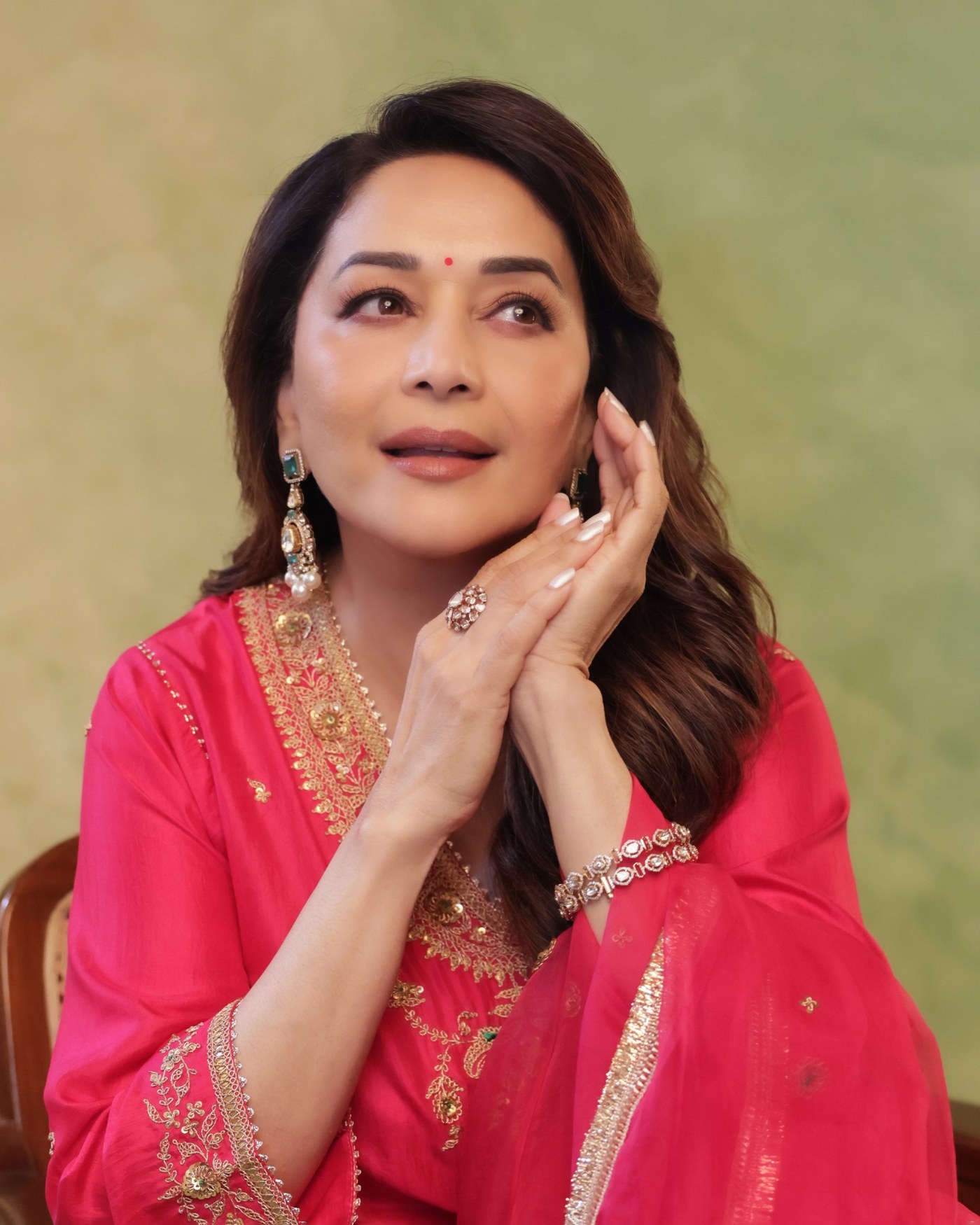 Madhuri Dixit’s Golden Glow: Effortless Elegance in Pink Perfection