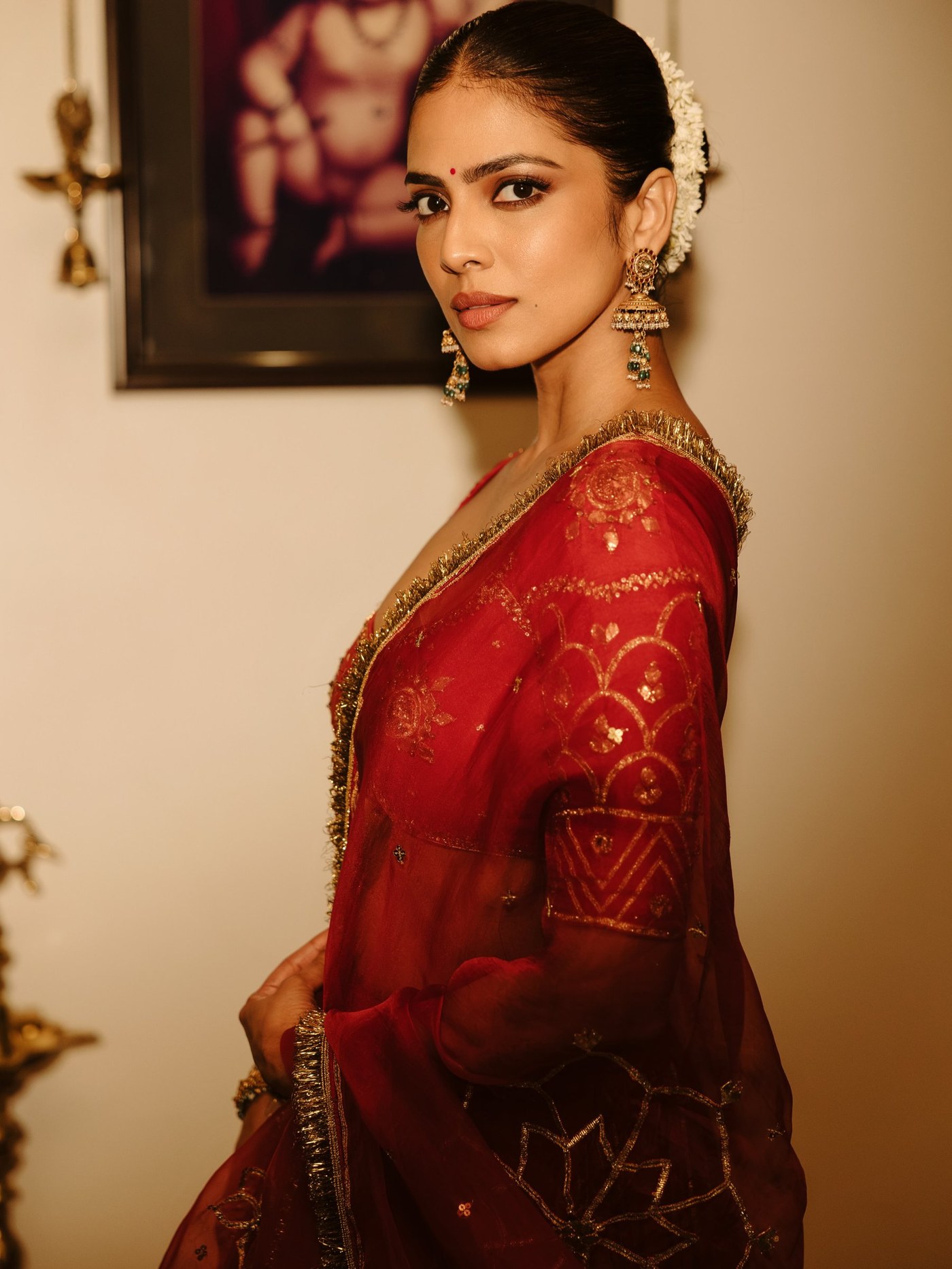 Red Lehenga Detail: Malavika's Festive Ensemble Analysis
