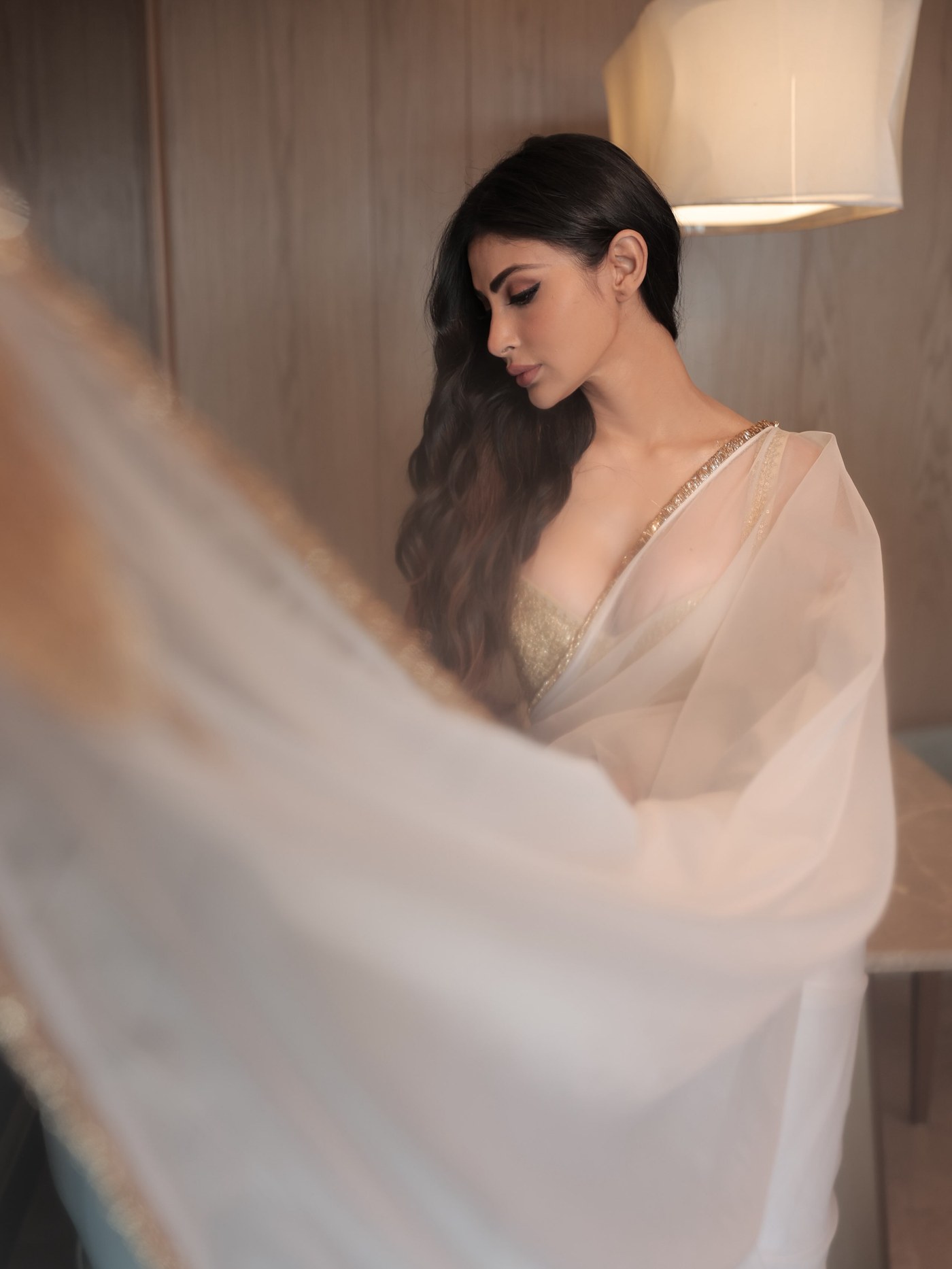 Mouni Roy in a sheer white saree with delicate gold borders. - Photos & Updates