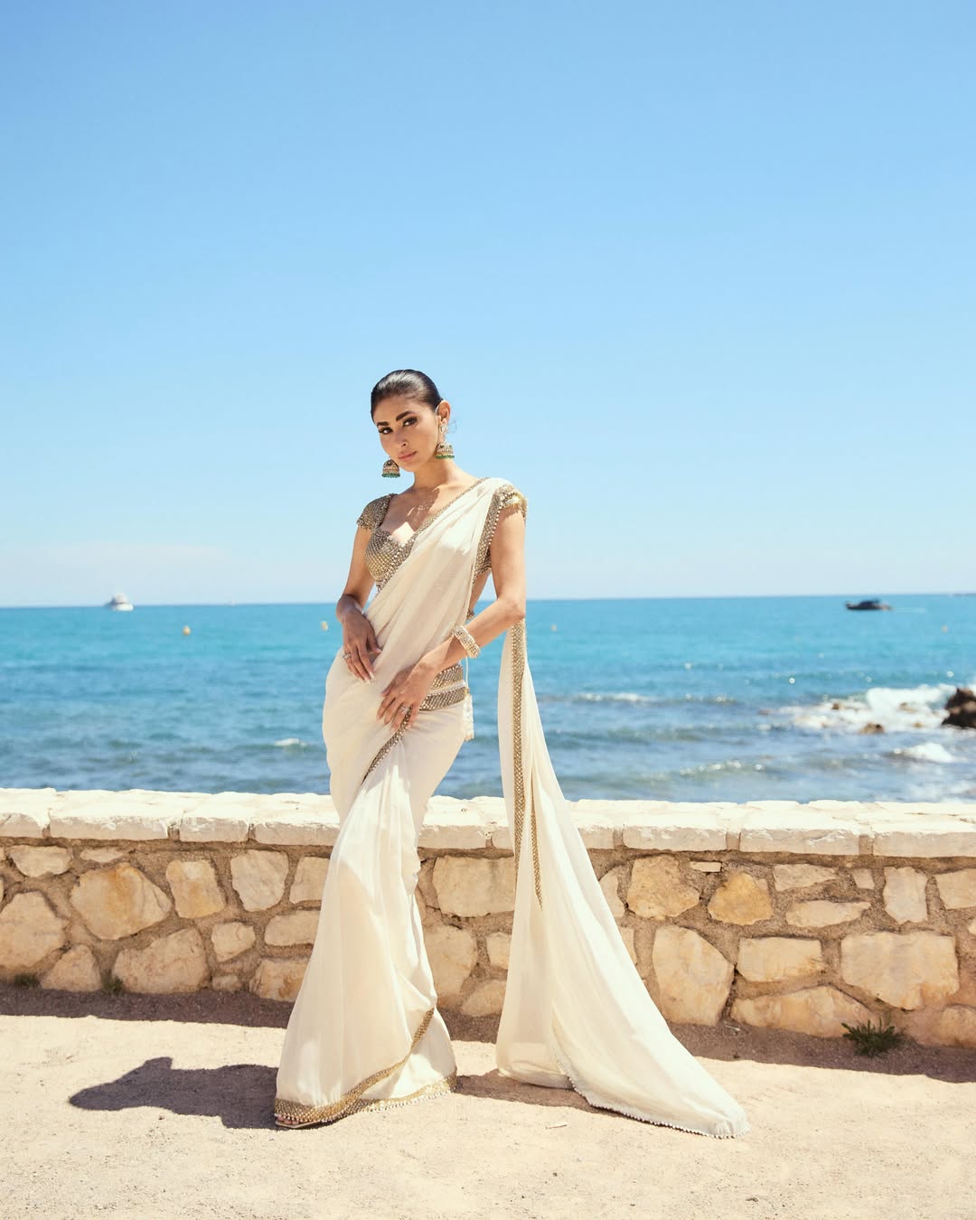 Mouni Roy Glows in Ivory Gold Saree: A Regal Beachside Dream