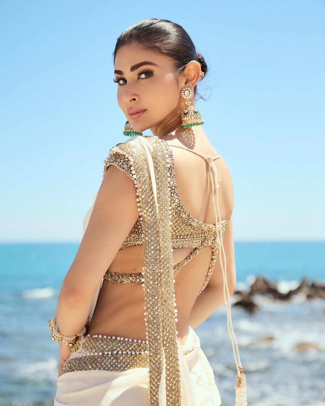 Mouni Roy Glows in Ivory Gold Saree: A Regal Beachside Dream