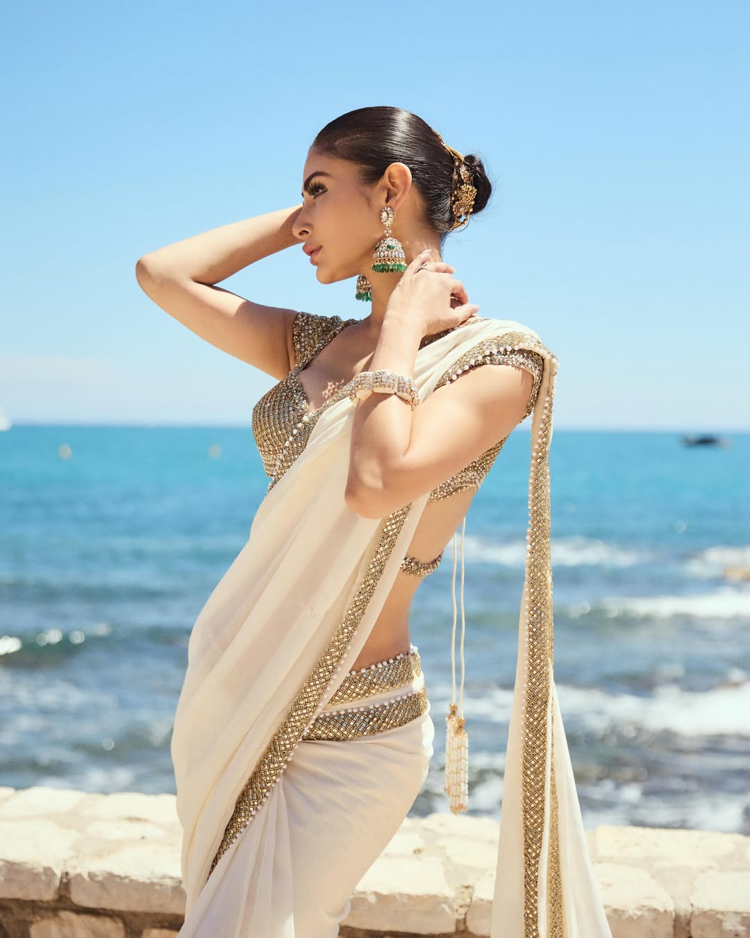 Mouni Roy Glows in Ivory Gold Saree: A Regal Beachside Dream
