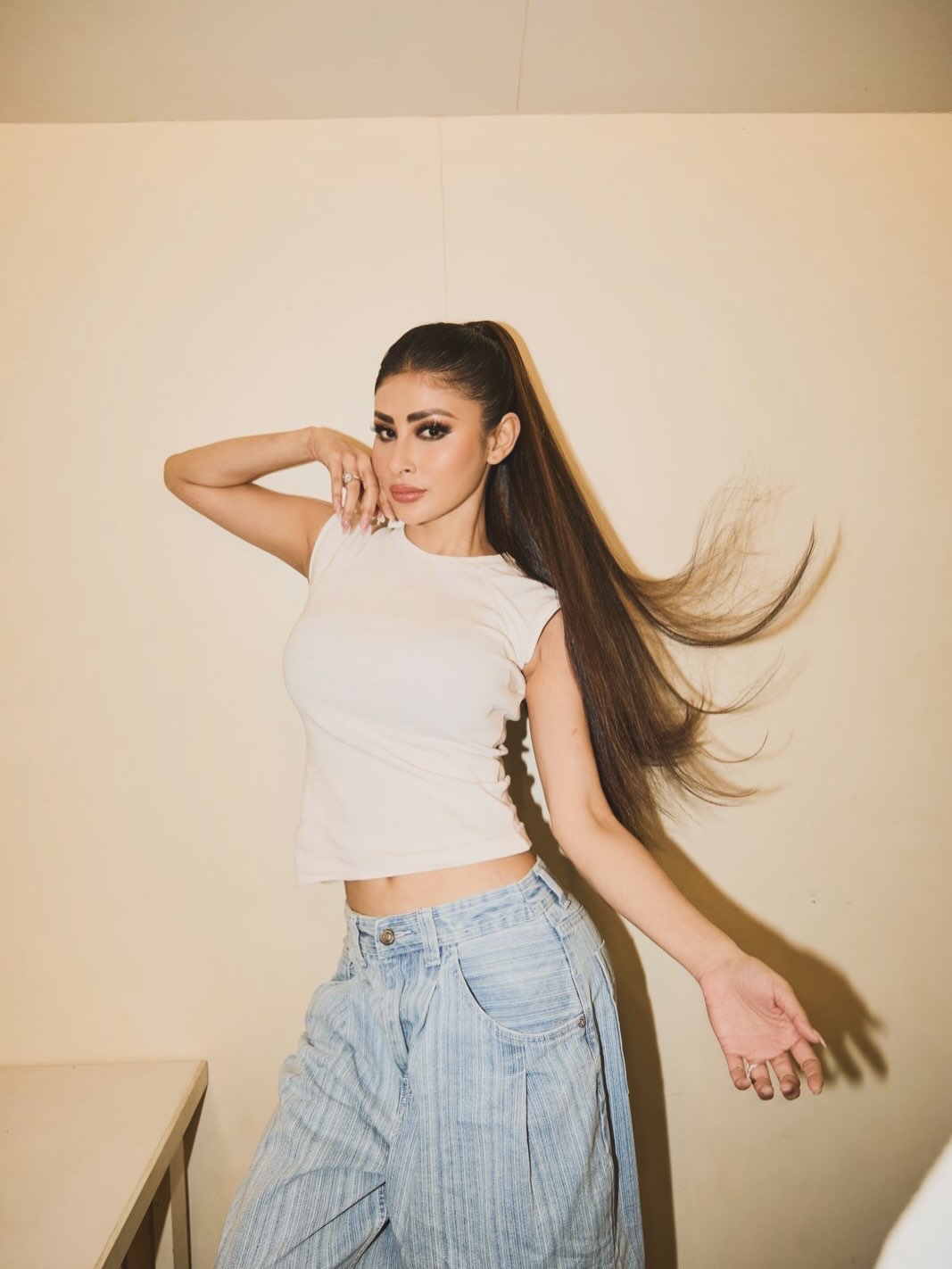 Denim Reimagined: Mouni Roy's High-Waisted White Top Look