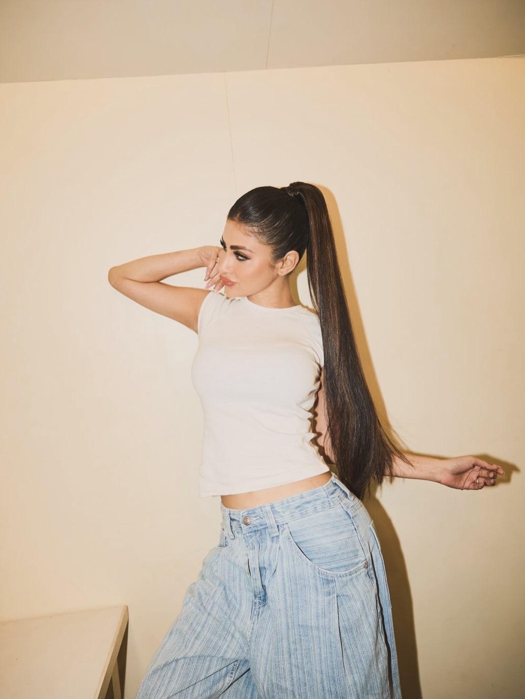 Denim Reimagined: Mouni Roy's High-Waisted White Top Look