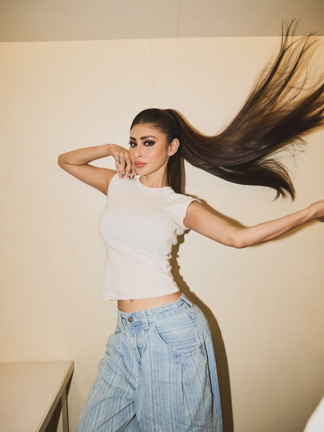 Denim Reimagined: Mouni Roy's High-Waisted White Top Look