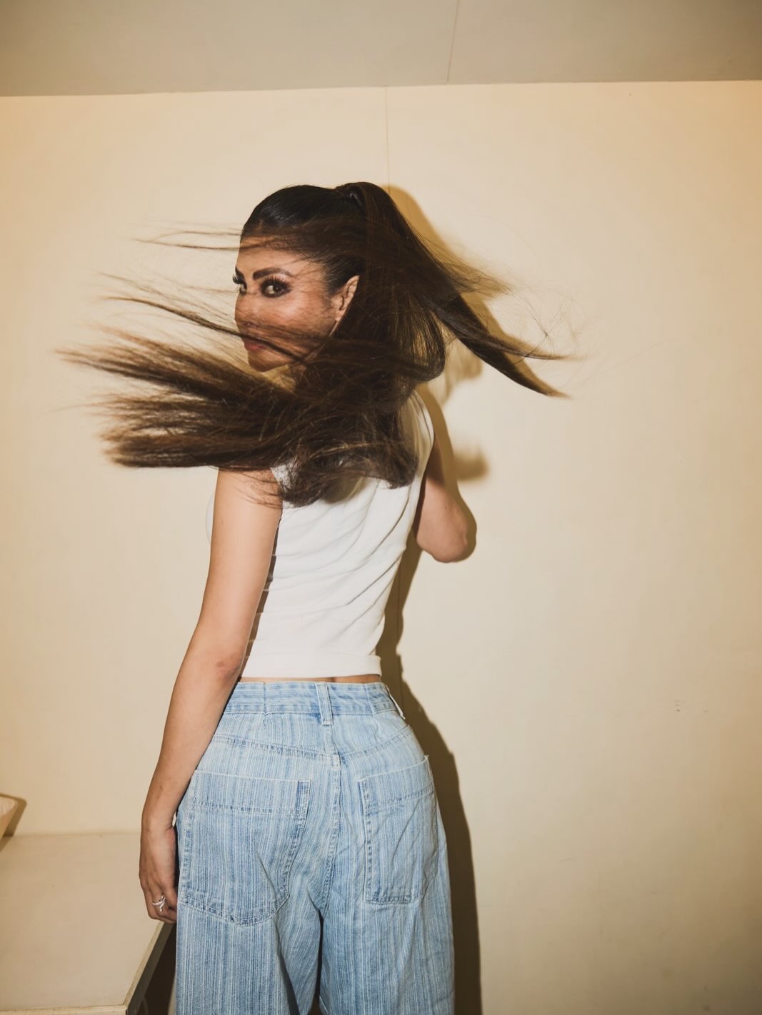 Denim Reimagined: Mouni Roy's High-Waisted White Top Look
