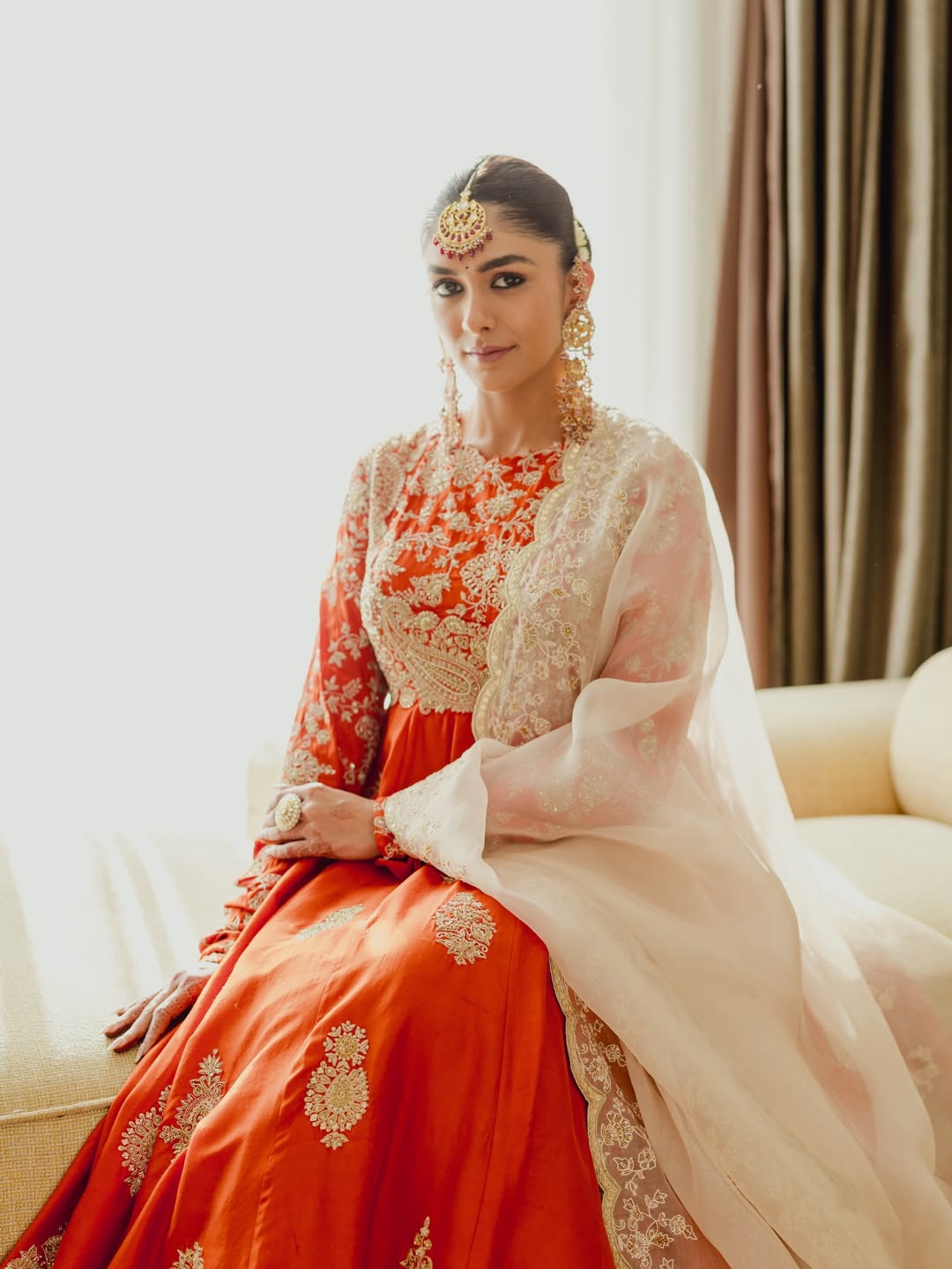 Mrunal Thakur's Regal Glow: Gold and Vermilion Splendor