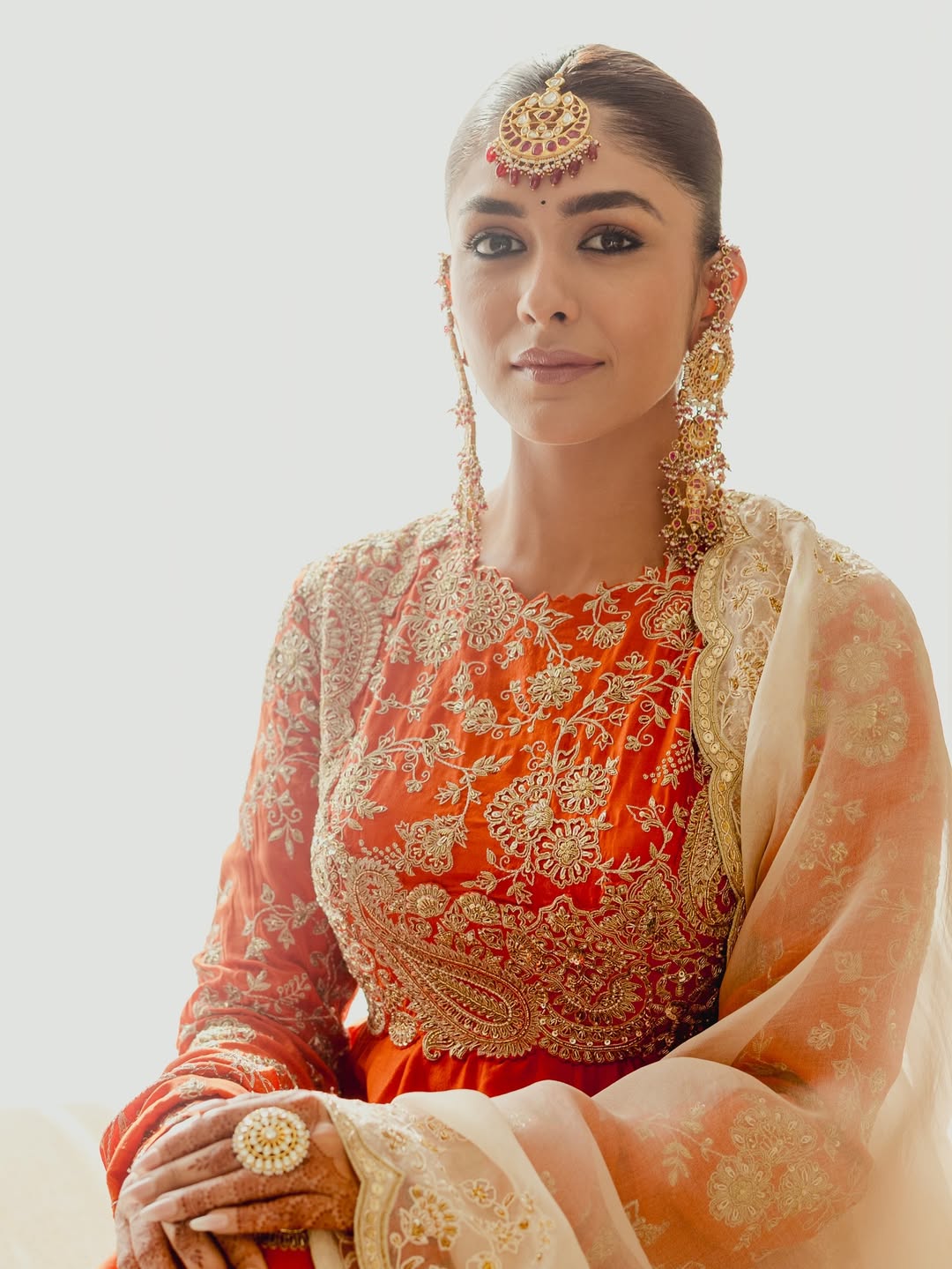 Mrunal Thakur's Regal Glow: Gold and Vermilion Splendor
