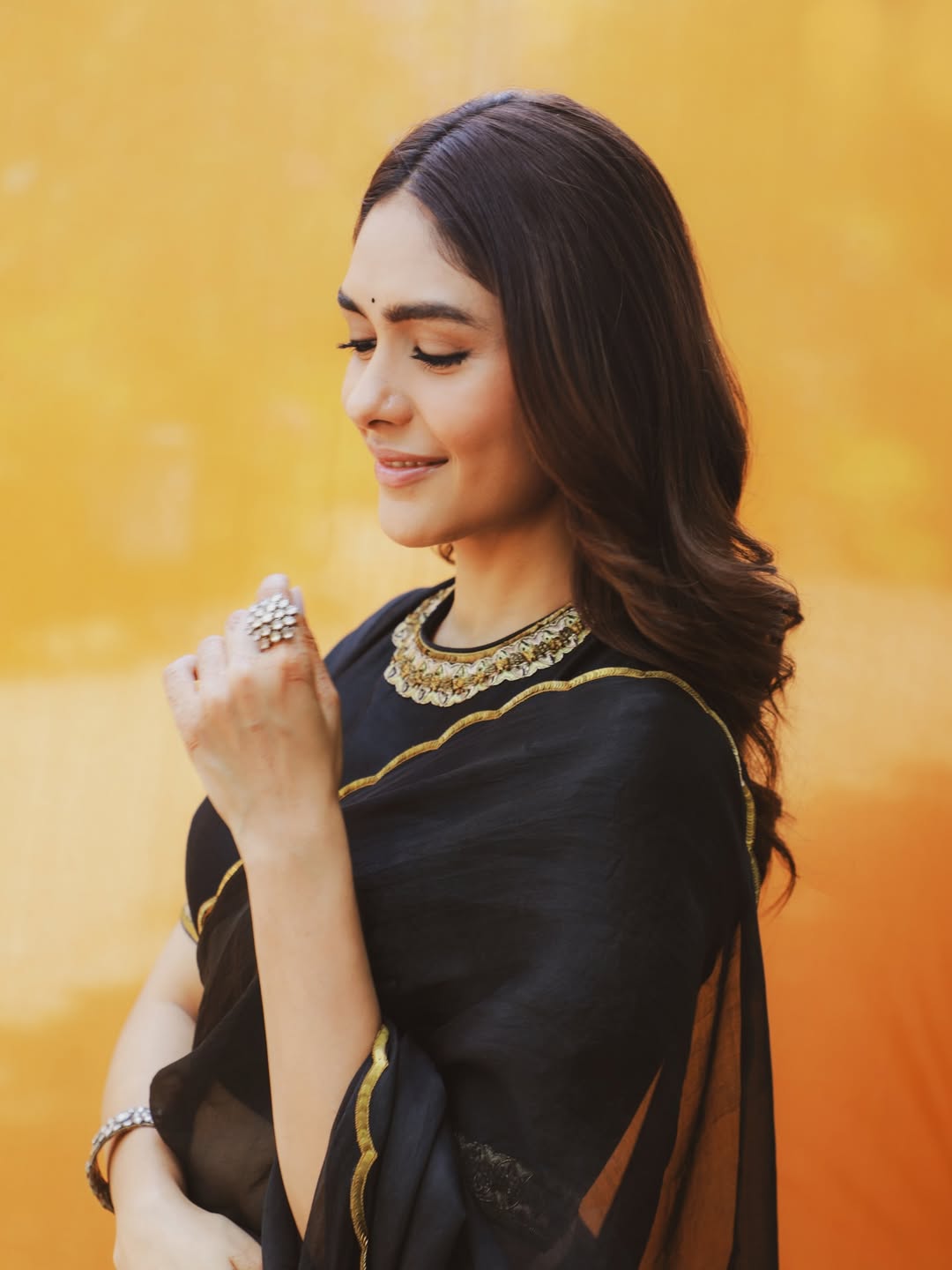 Mrunal Thakur's Golden Radiance: A Stunning Photo Gallery