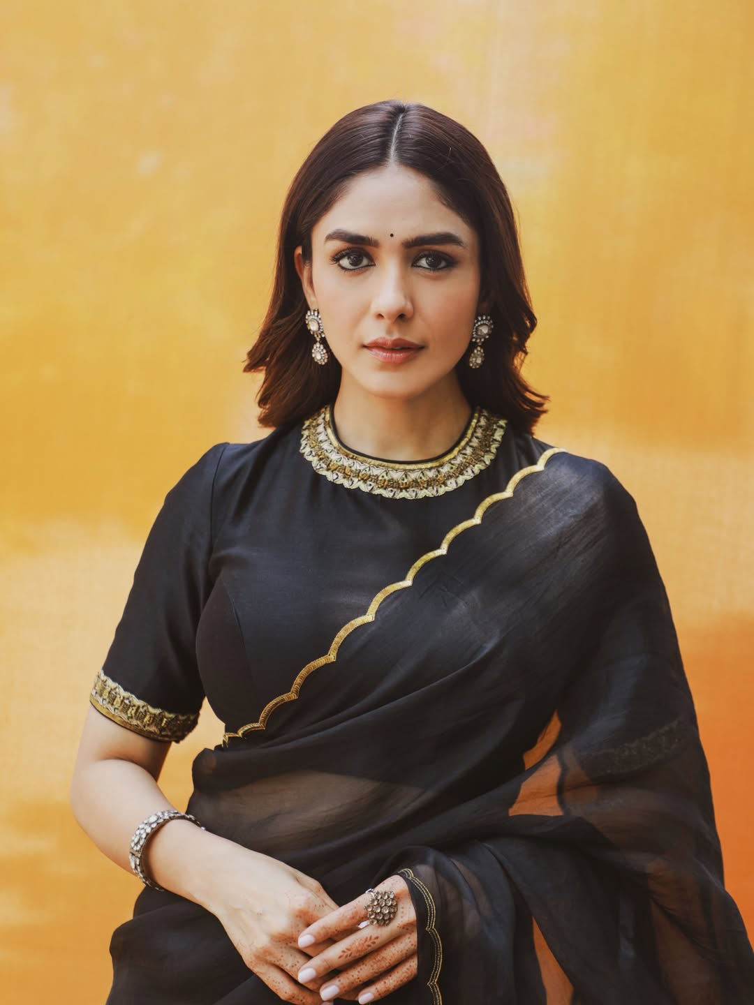 Mrunal Thakur's Golden Radiance: A Stunning Photo Gallery