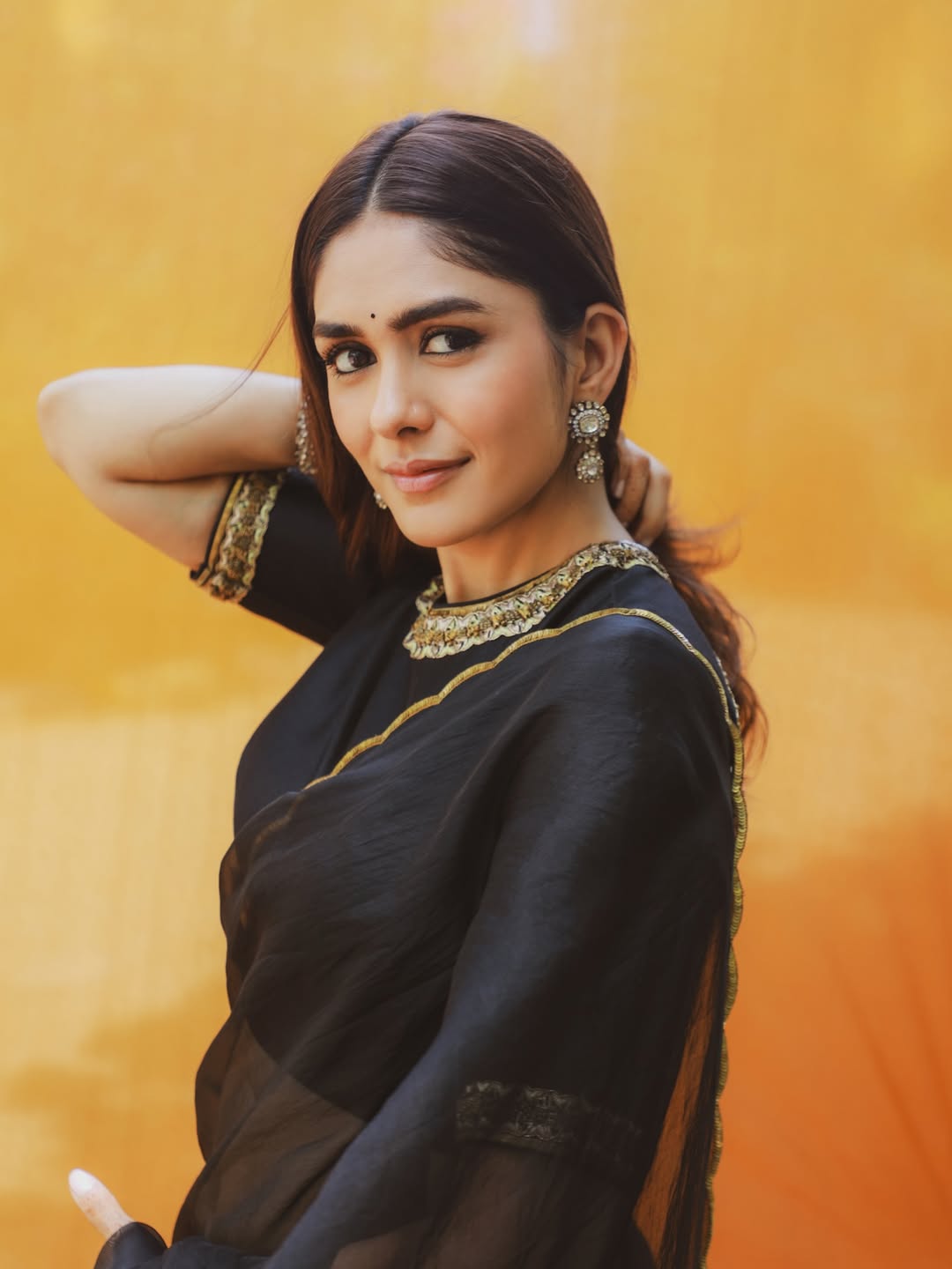Mrunal Thakur's Golden Radiance: A Stunning Photo Gallery