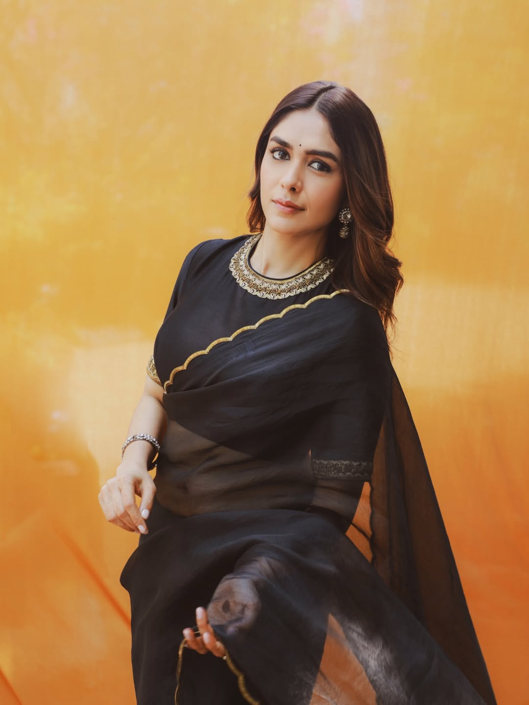 Mrunal Thakur's Golden Radiance: A Stunning Photo Gallery