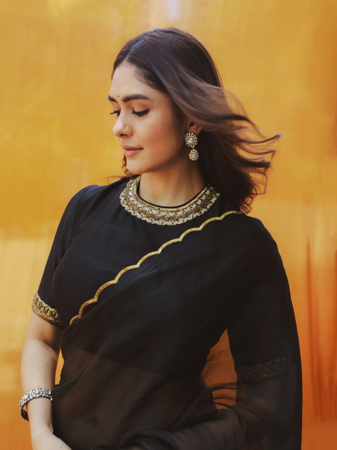 Mrunal Thakur's Golden Radiance: A Stunning Photo Gallery