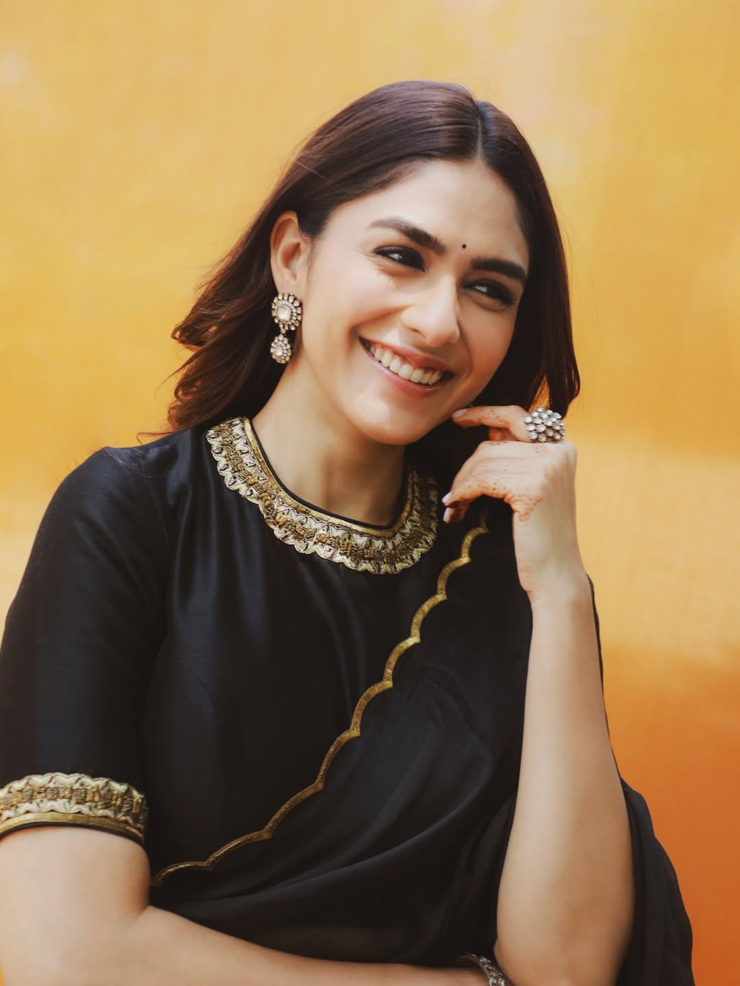 Mrunal Thakur's Golden Radiance: A Stunning Photo Gallery