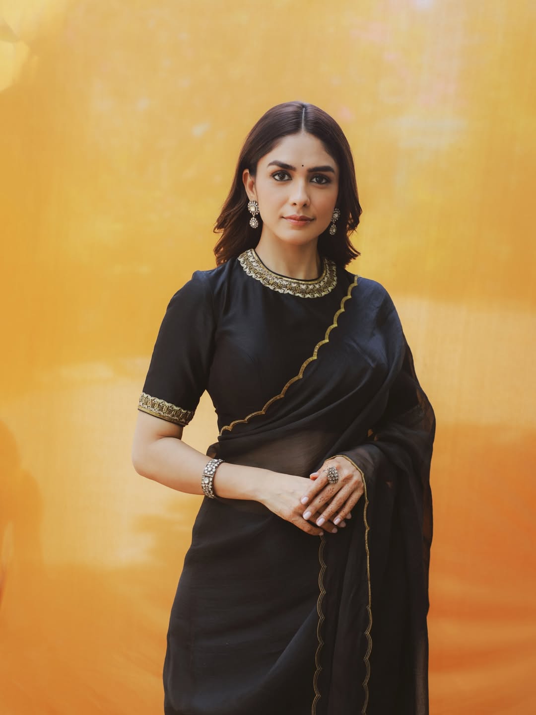 Mrunal Thakur's Golden Radiance: A Stunning Photo Gallery