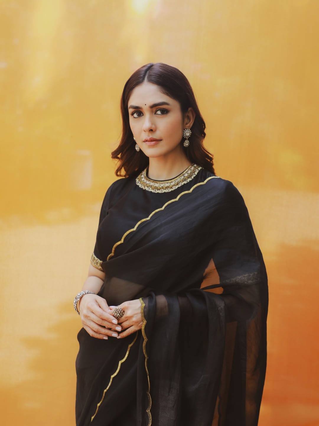 Mrunal Thakur's Golden Radiance: A Stunning Photo Gallery