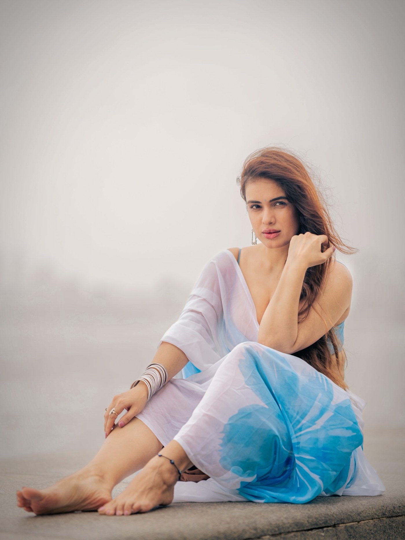 Neha Malik showcases a striking blue and white desi-inspired ensemble, embodying modern festive elegance. - Photos & Updates
