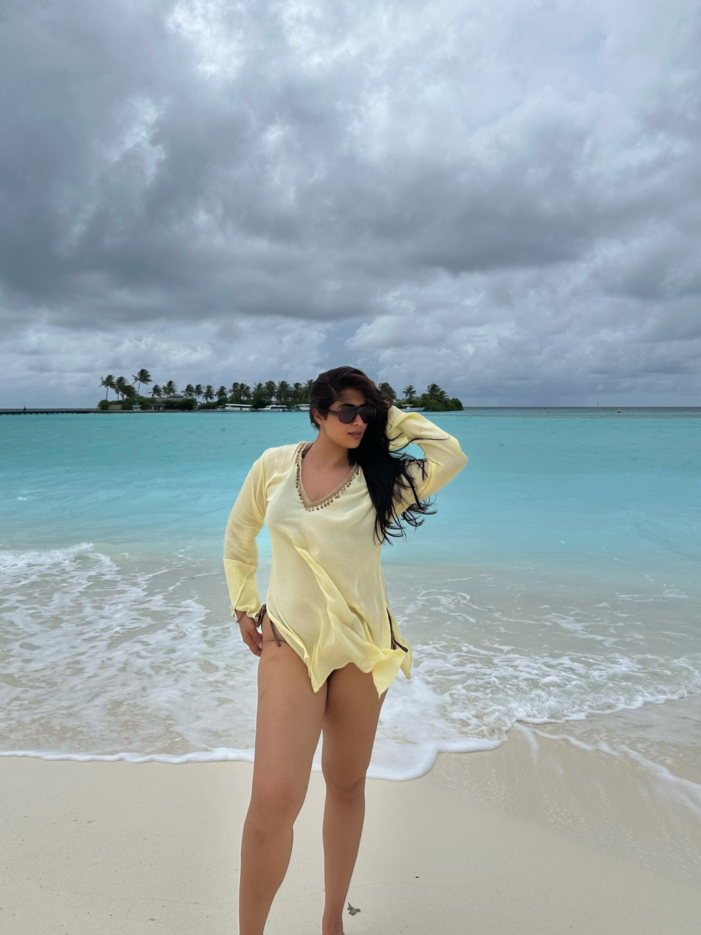 Nikita Sharma shines in a vibrant bikini set and flowing butter-toned kaftan while enjoying the Maldives setting. - Photos & Updates