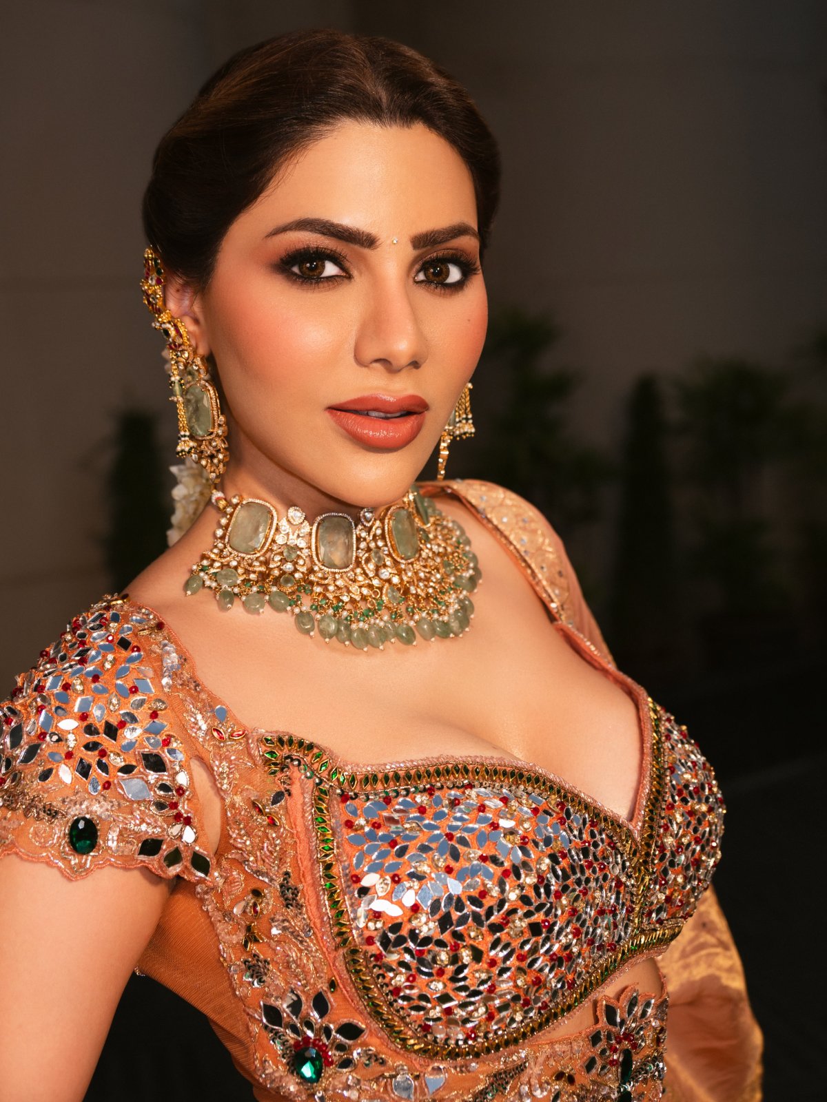 Peach Lehenga Paired With Green Stone Jewellery