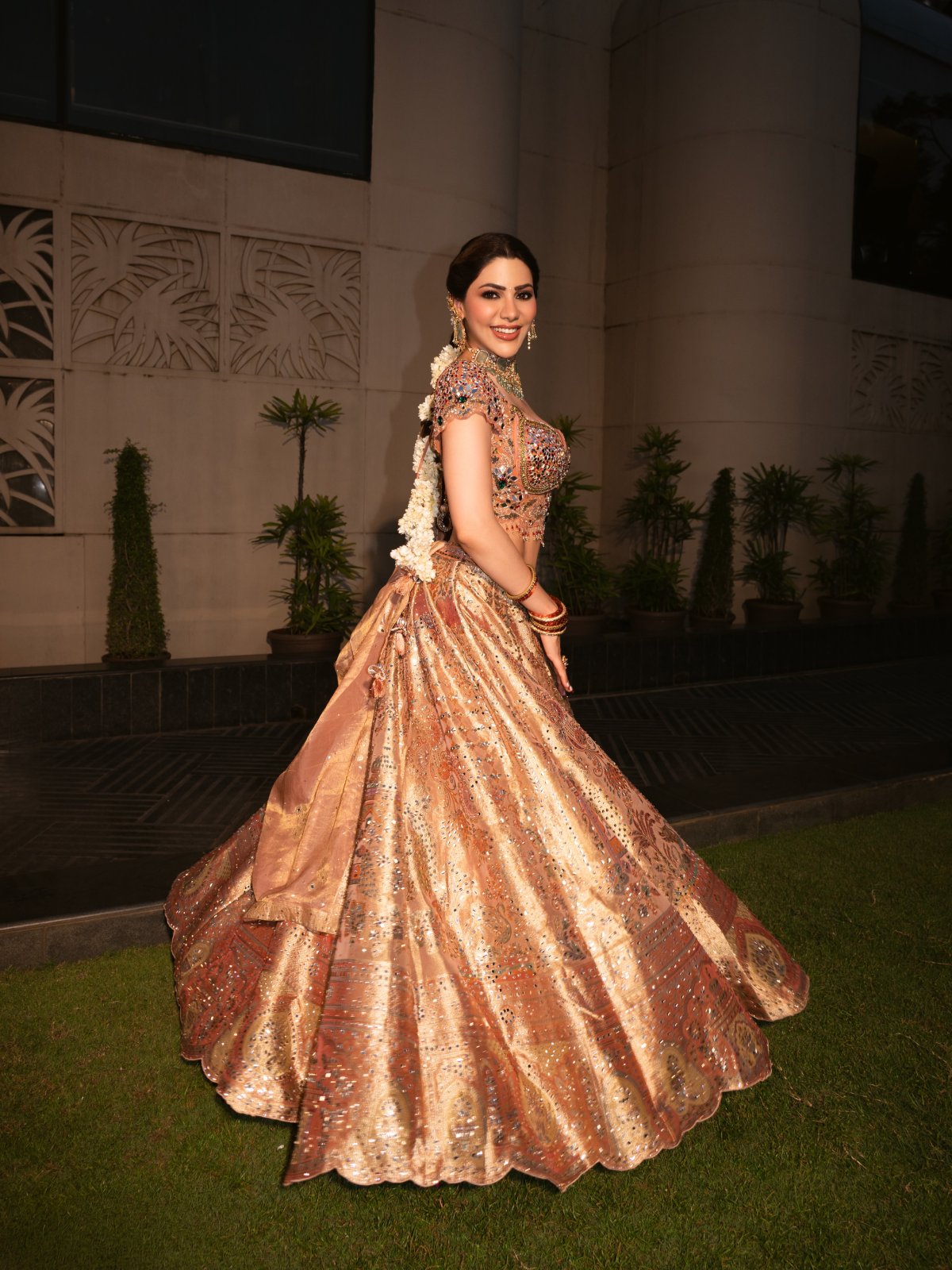 Peach Lehenga Paired With Green Stone Jewellery