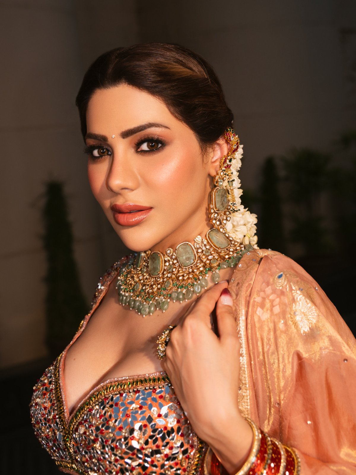 Peach Lehenga Paired With Green Stone Jewellery