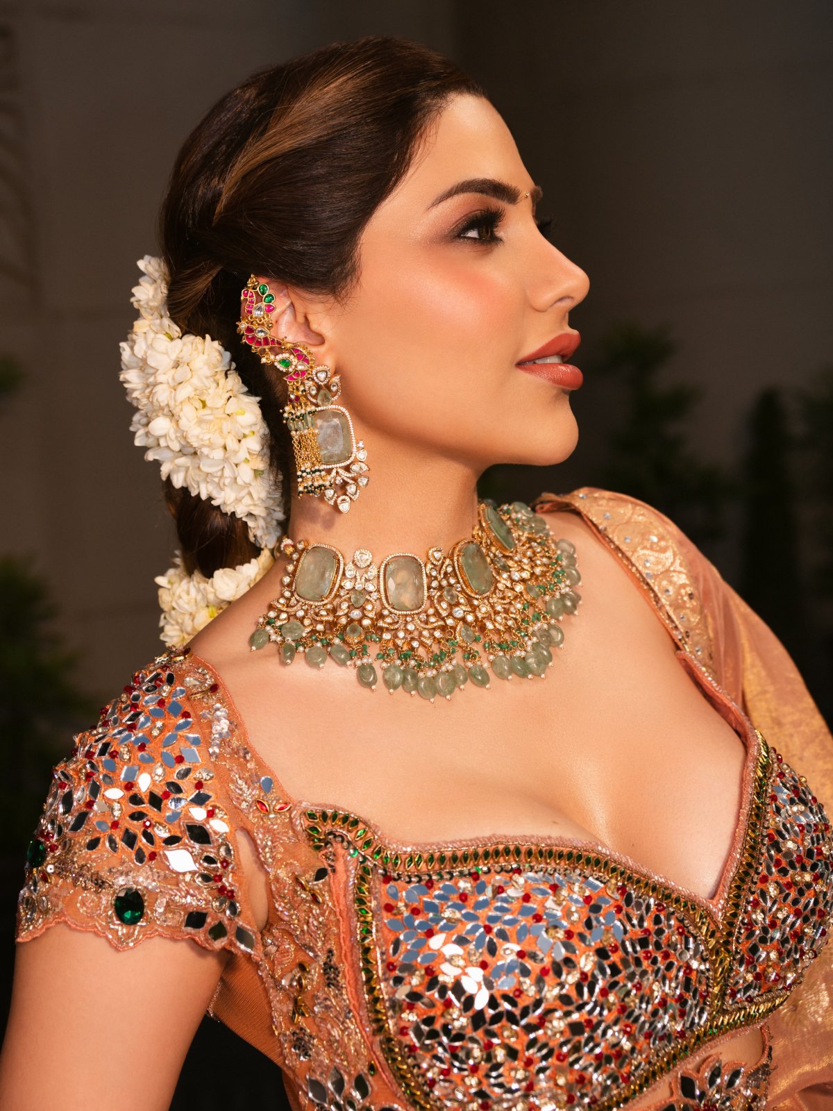 Peach Lehenga Paired With Green Stone Jewellery