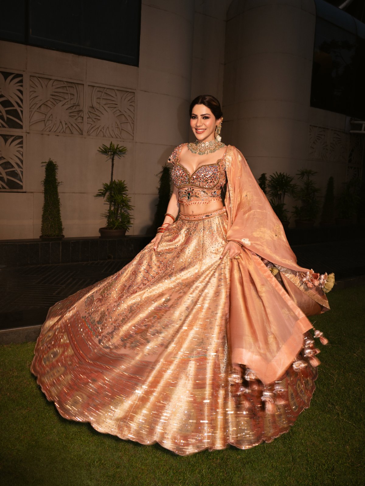 Peach Lehenga Paired With Green Stone Jewellery